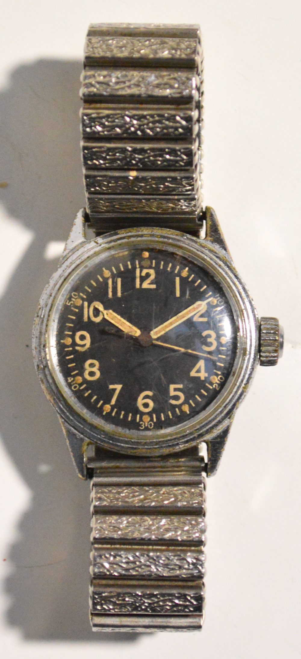 A WWII military issue stainless steel Elgin wristwatch, the black circular dial set with Arabic