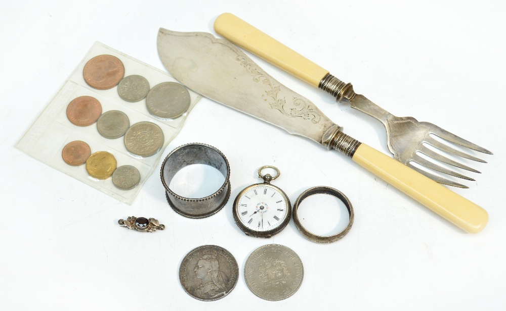 A Continental silver open face fob watch with white enamel dial, a silver napkin ring, a plated