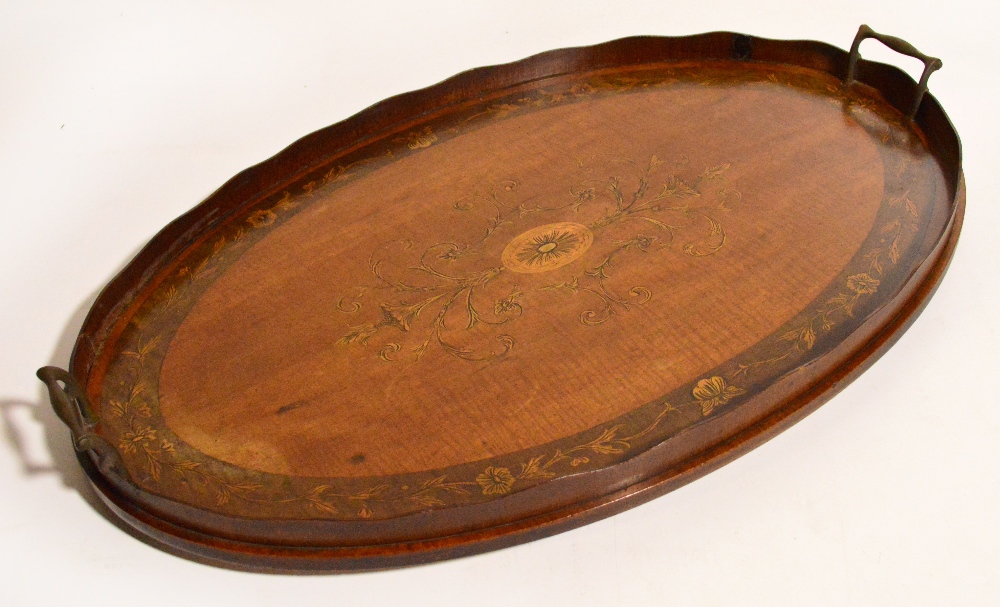An Edwardian mahogany and satinwood inlaid twin handled oval tray, length 67cm.
