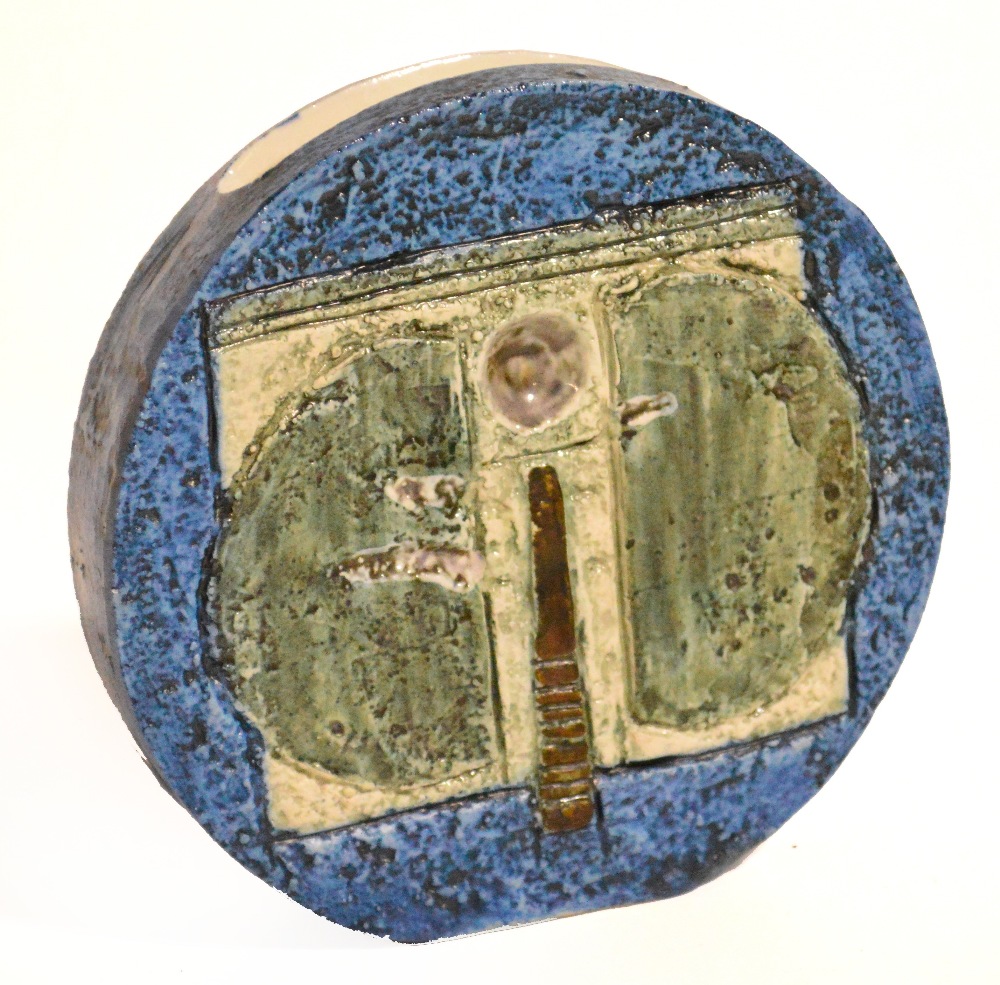 A small Troika wheel vase decorated in shades of green and blue, printed marks to base, artist