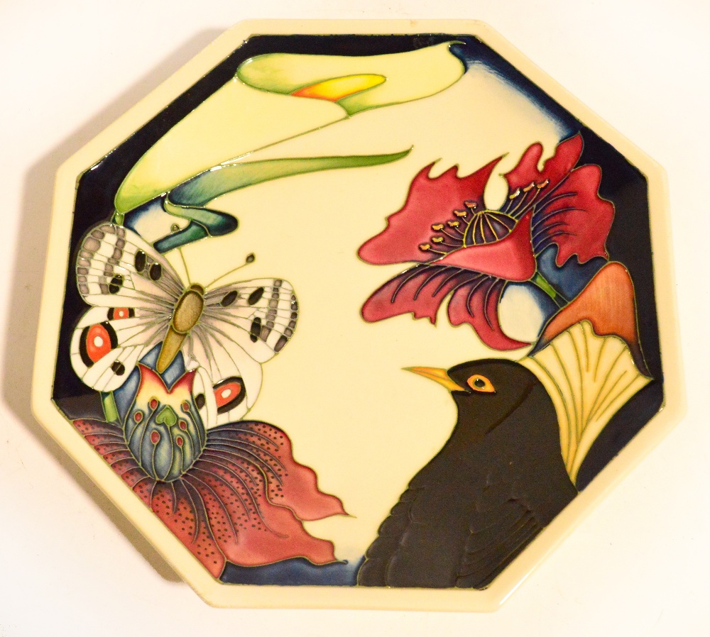 An unusual Moorcroft octagonal dish with tubeline decoration of a blackbird, butterfly and floral