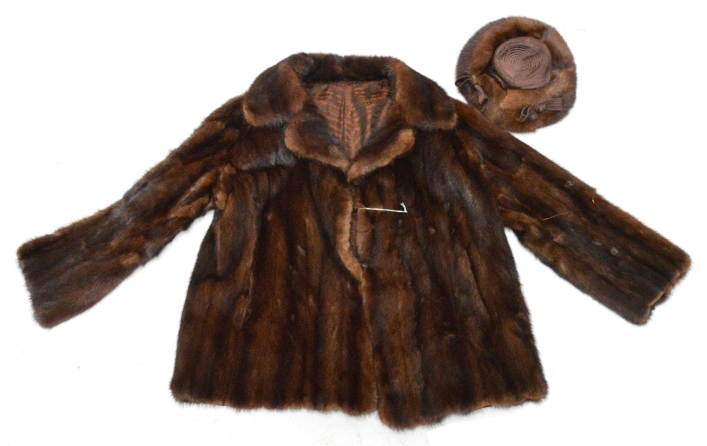 A vintage ladies half length fur coat sold with matching hat. CONDITION REPORT: Minor wear