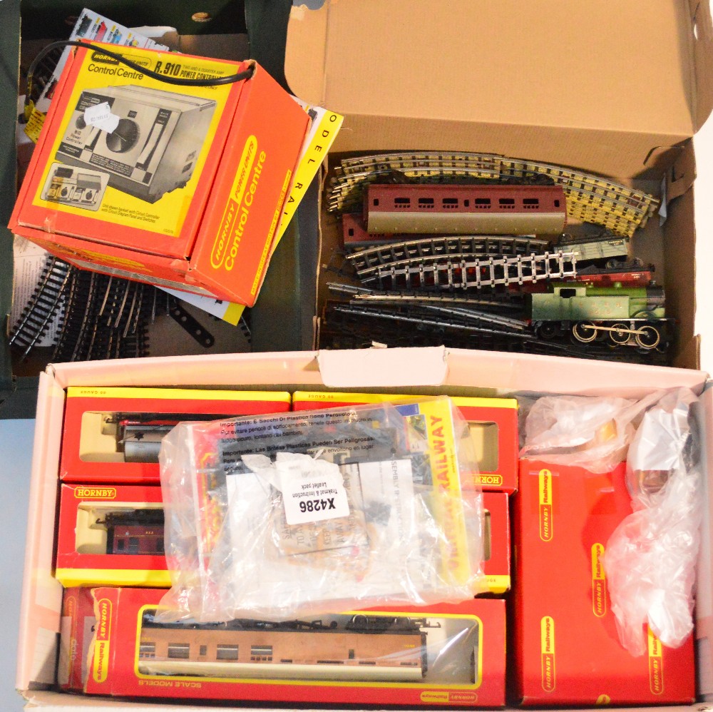 A quantity of boxed Hornby carriages and tenders, a Hornby LNER engine, quantity of track, a boxed