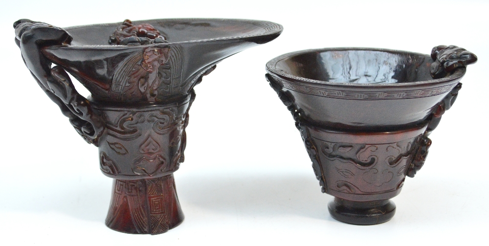 WITHDRAWN
Two decorative Oriental resin libation cups decorated in the typical style with dragons,