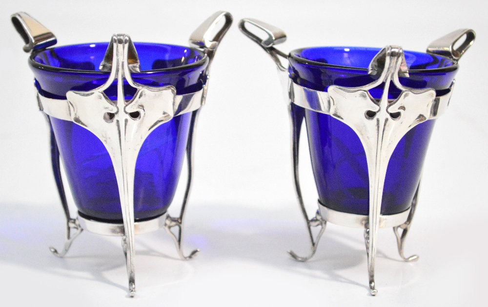 A pair of Edward VII hallmarked silver Art Nouveau stands with three stylised supports and with blue