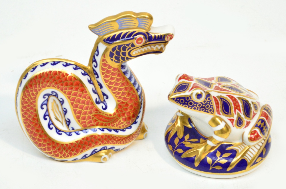 Two Royal Crown Derby paperweights, one with gilt stopper, the other a second and lacking stopper.