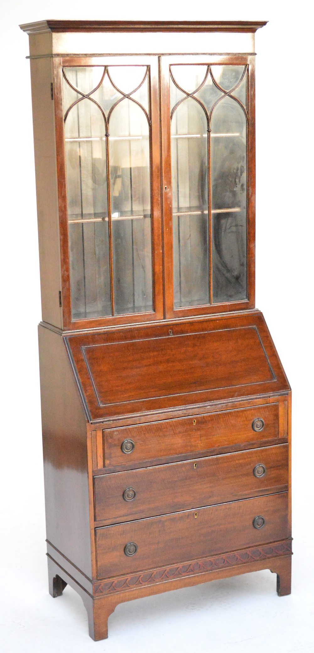 An early 20th century mahogany bureau bookcase with pair of glazed doors above fall front and
