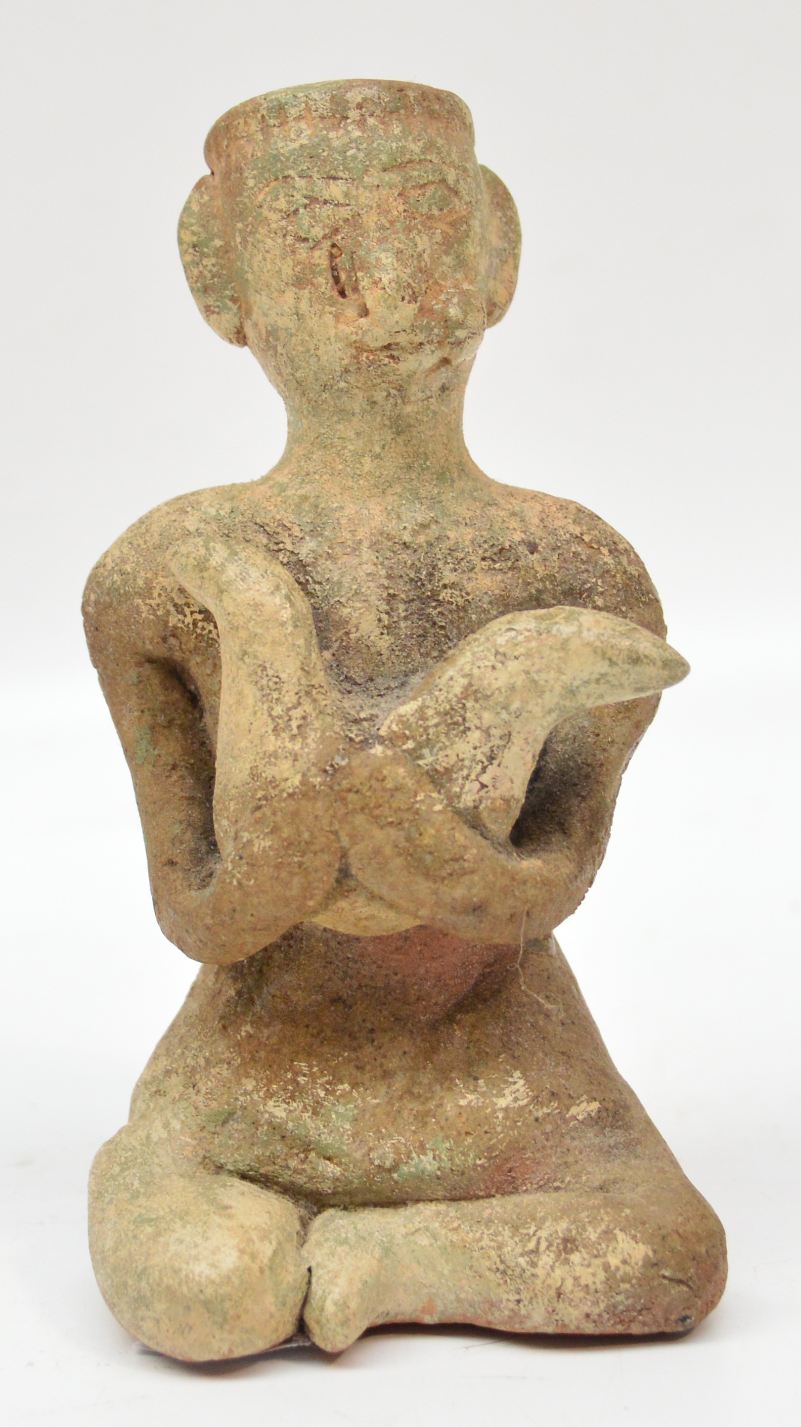 A 15th century Sawankhalok fertility figure depicting a seated man clutching a chicken, height