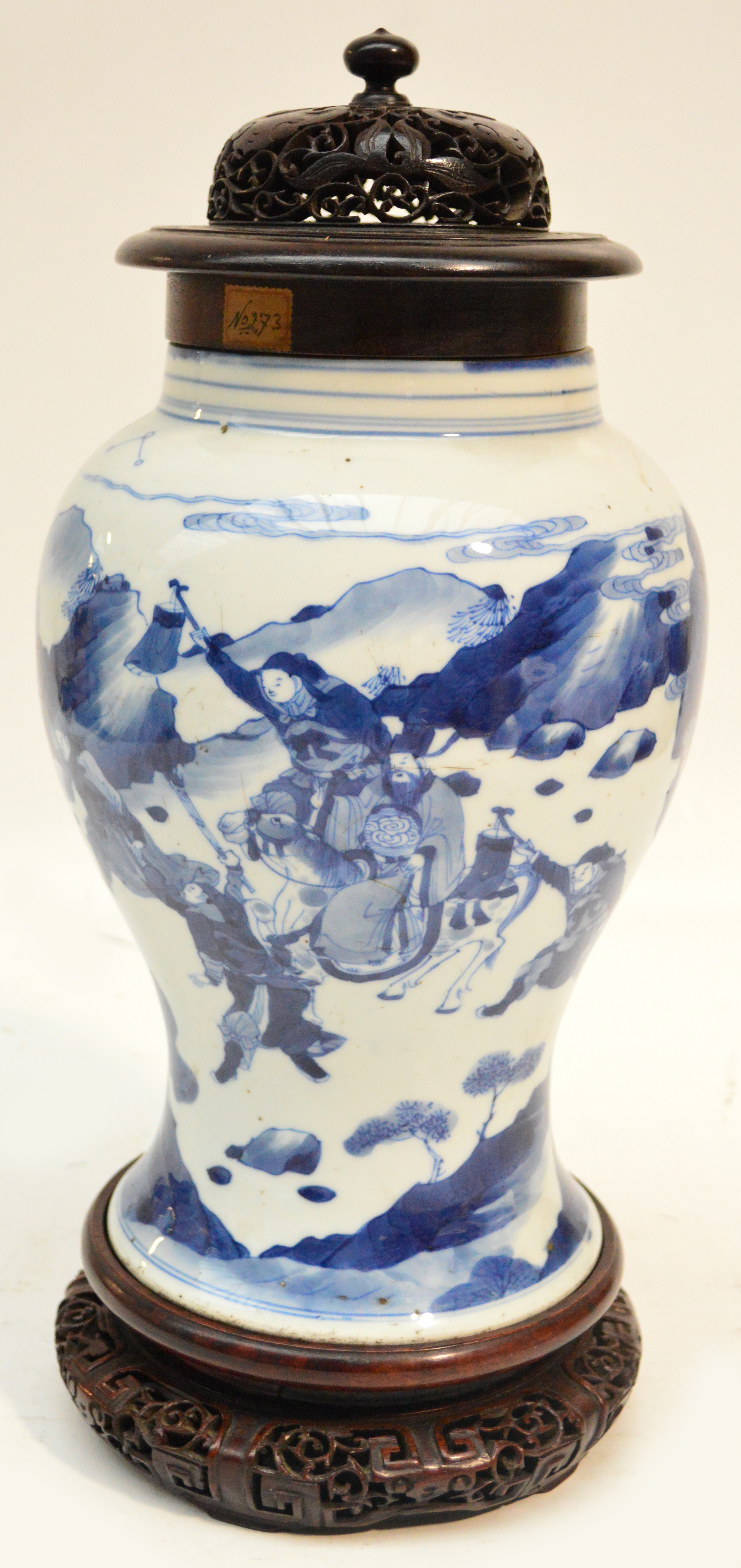 A Chinese porcelain Kangxi period baluster vase finely painted in underglaze blue with a