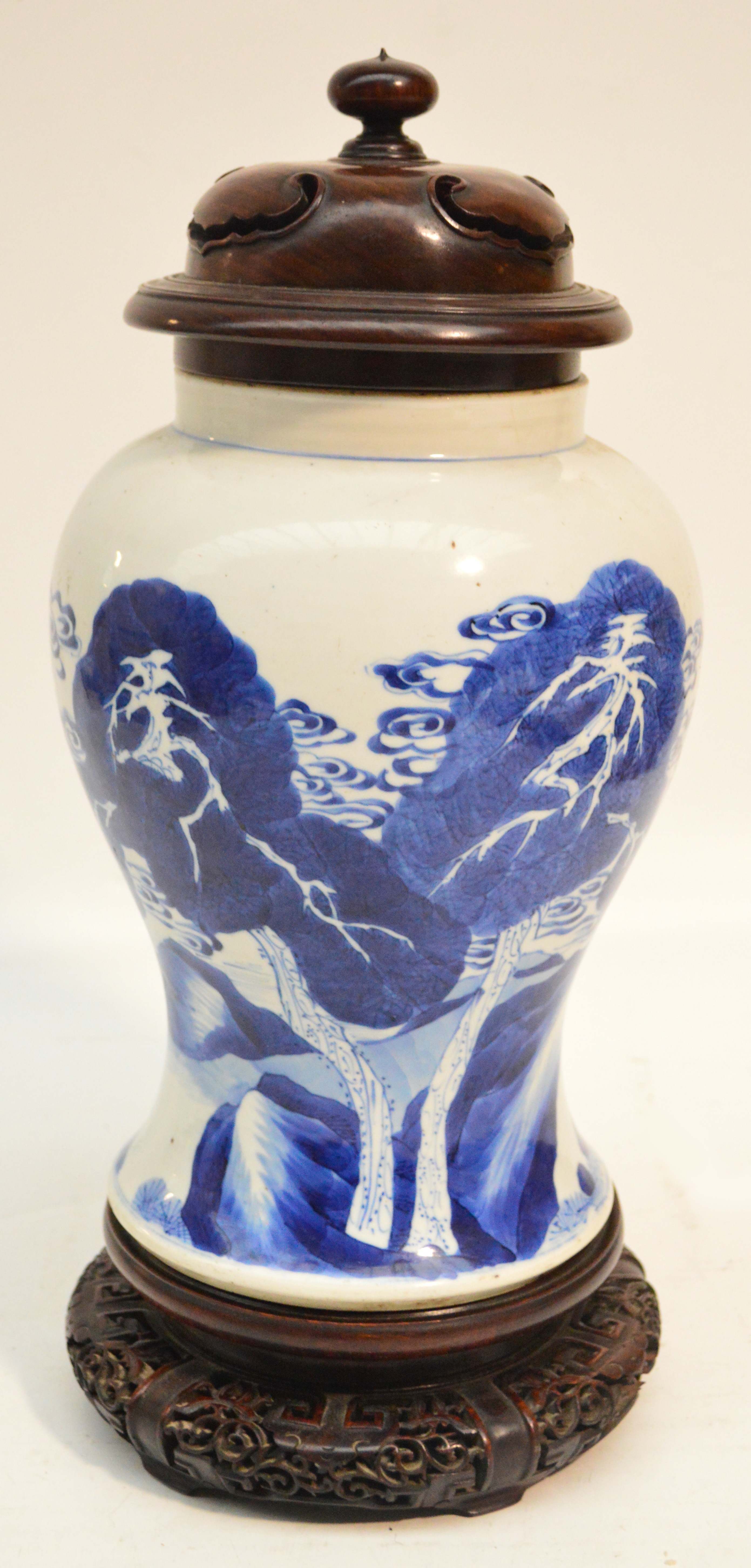 A Chinese Kangxi period porcelain baluster vase finely painted in underglaze blue with two roe