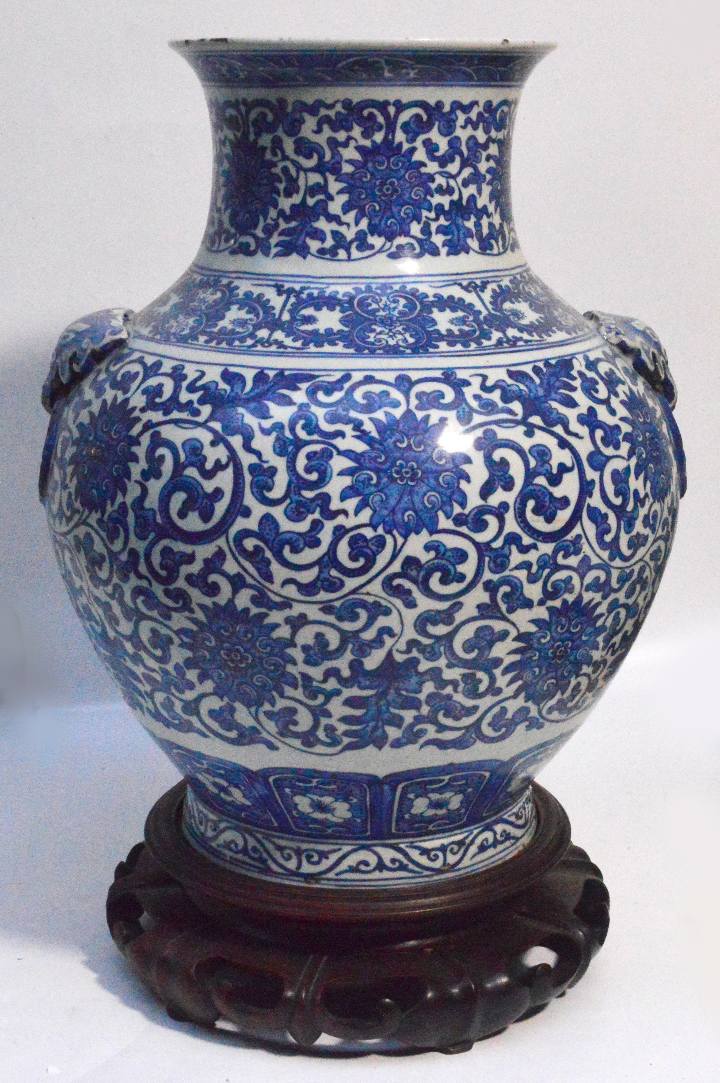 A large early 20th century Chinese blue and white baluster vase with taotie mask ring handles,