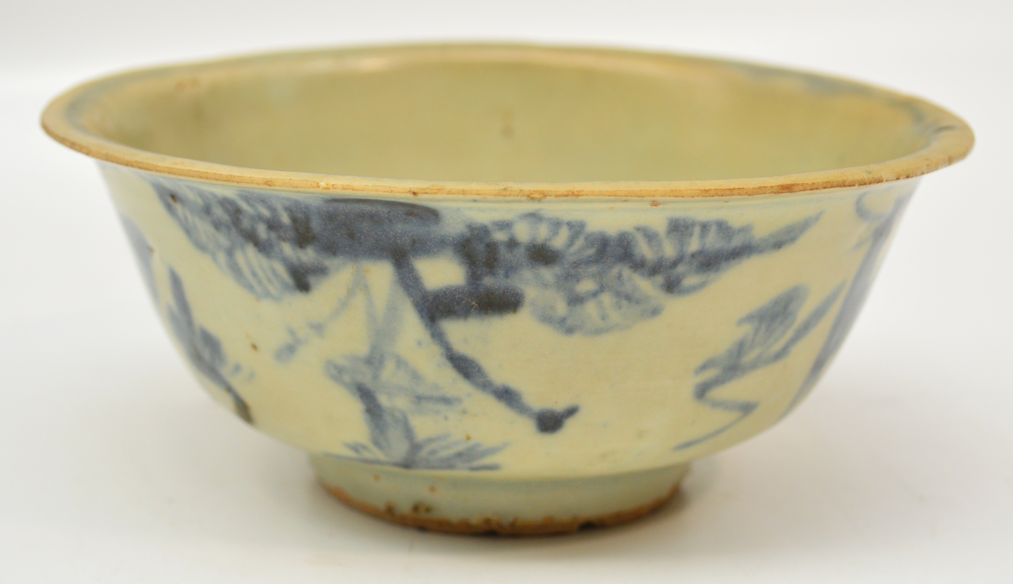 A 16th century Chinese porcelain bowl painted in underglaze blue with deer and floral sprays,