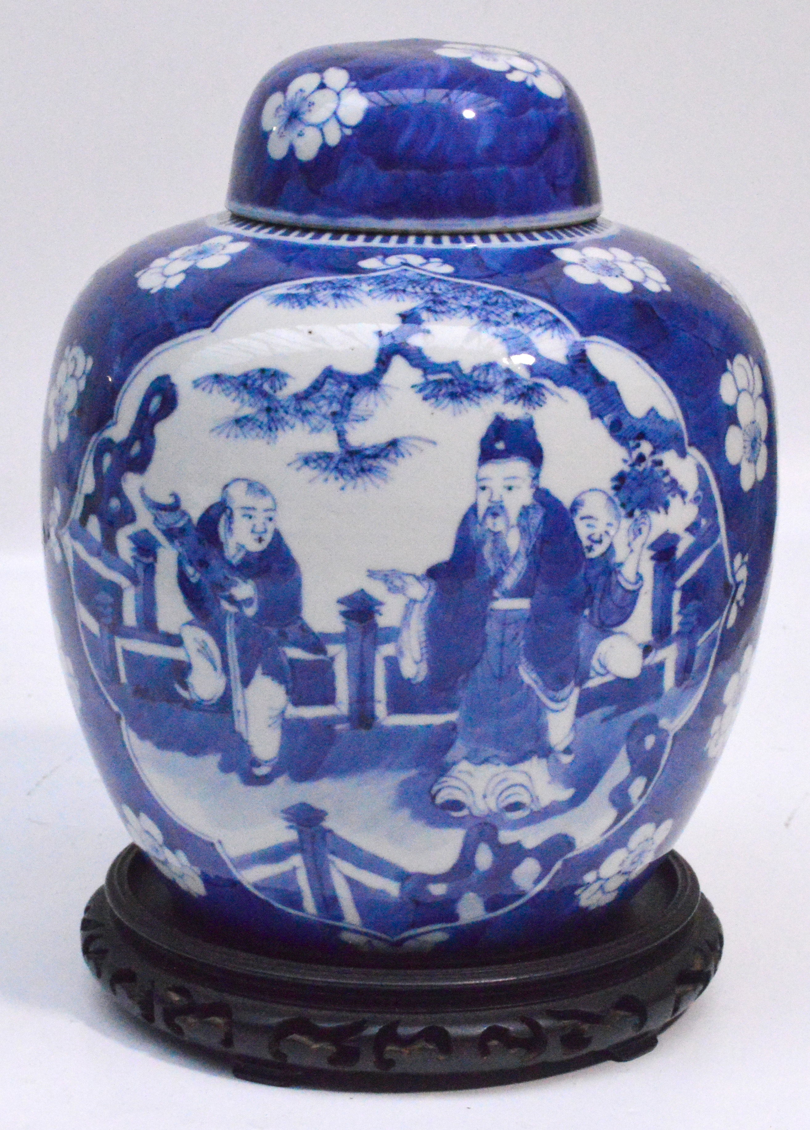 A 19th century Chinese porcelain ginger jar and cover painted in underglaze blue with two panels