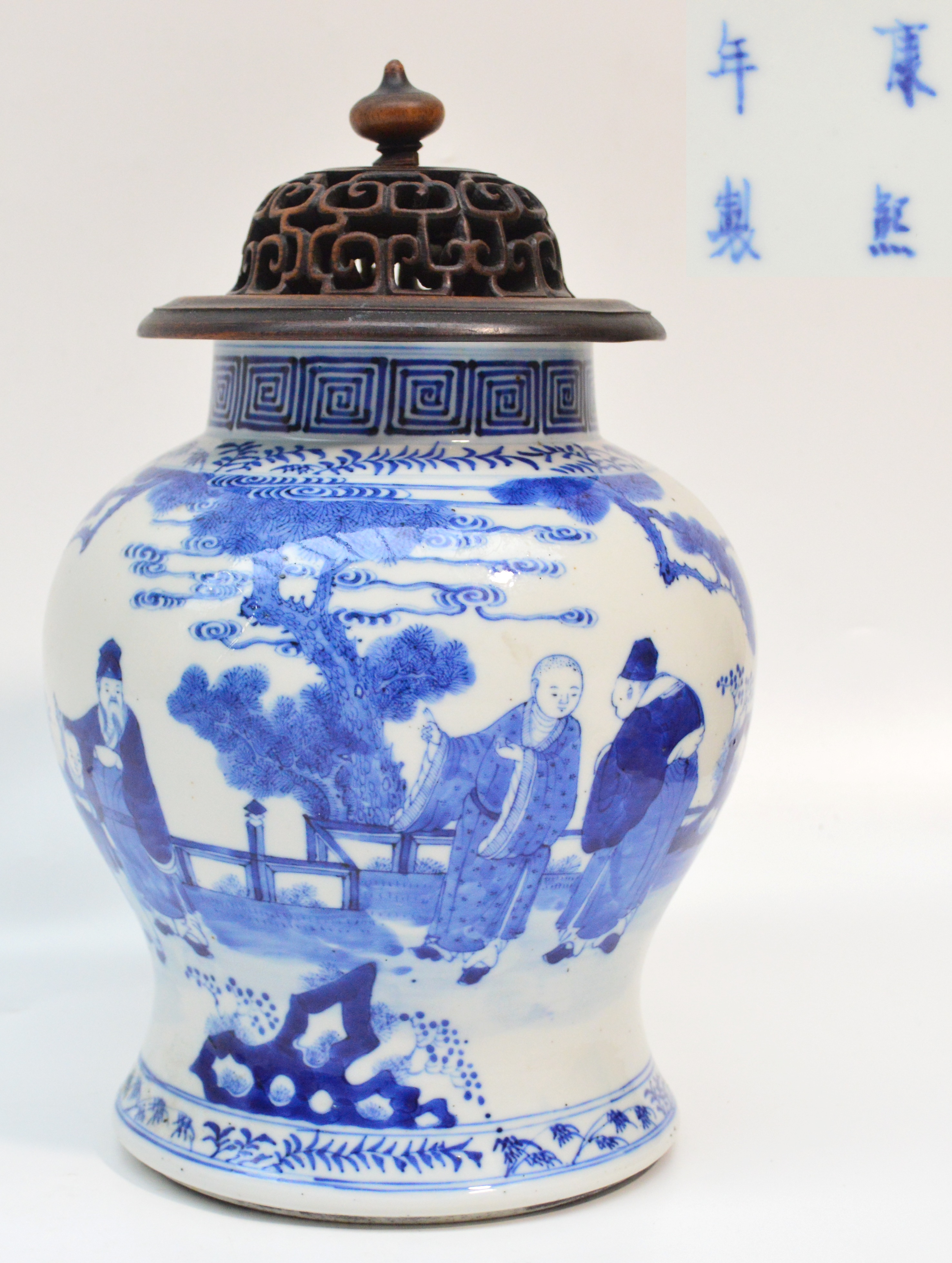 A 19th century Chinese porcelain baluster jar painted in underglaze blue with three elders and a