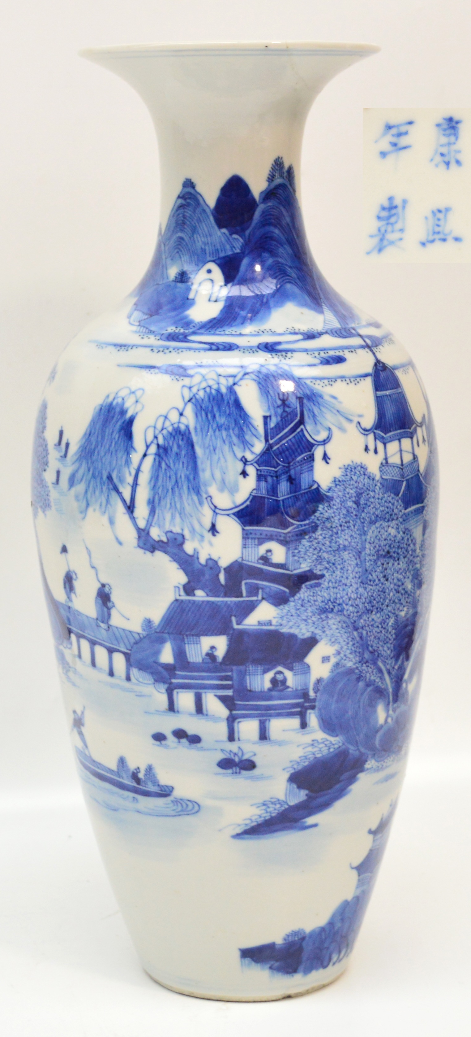 A 19th century Chinese porcelain baluster vase with flared rim, finely painted in underglaze blue