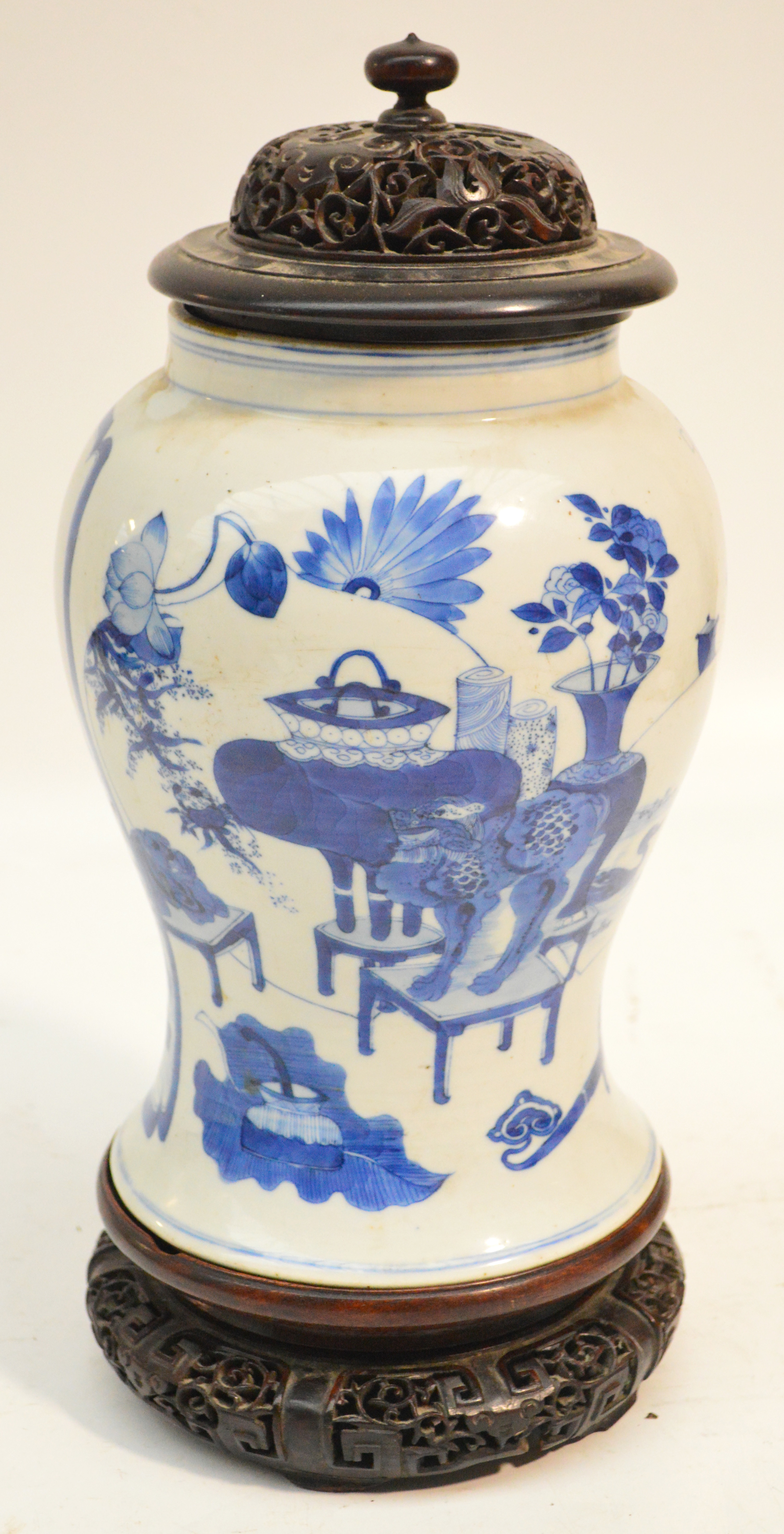 A Chinese porcelain Kangxi period baluster vase painted in underglaze blue with a panel of wading