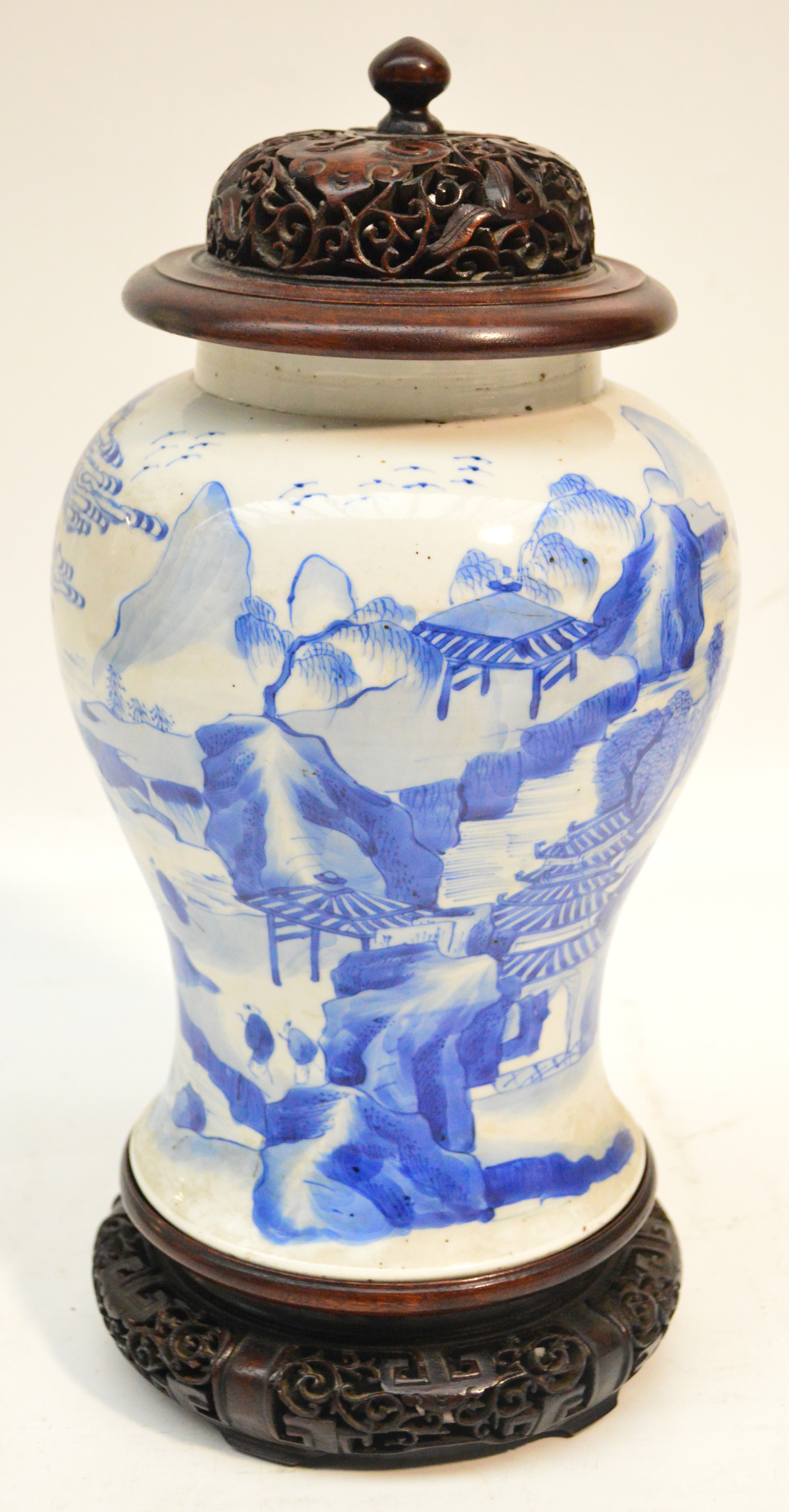 A 17th century Chinese porcelain baluster vase finely painted in underglaze blue with a continuous