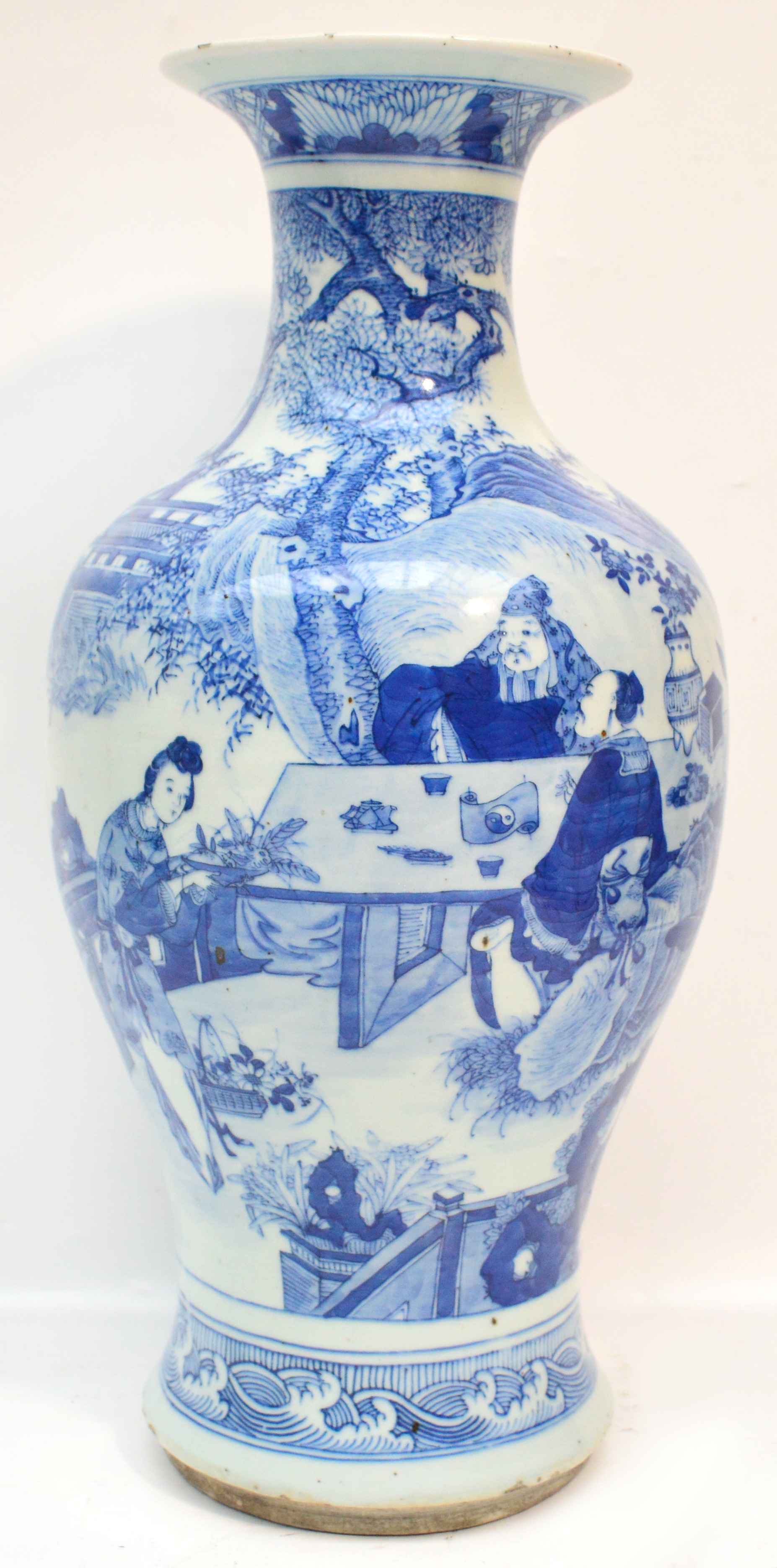 An 18th/19th century Chinese porcelain baluster vase with flared rim finely painted in underglaze