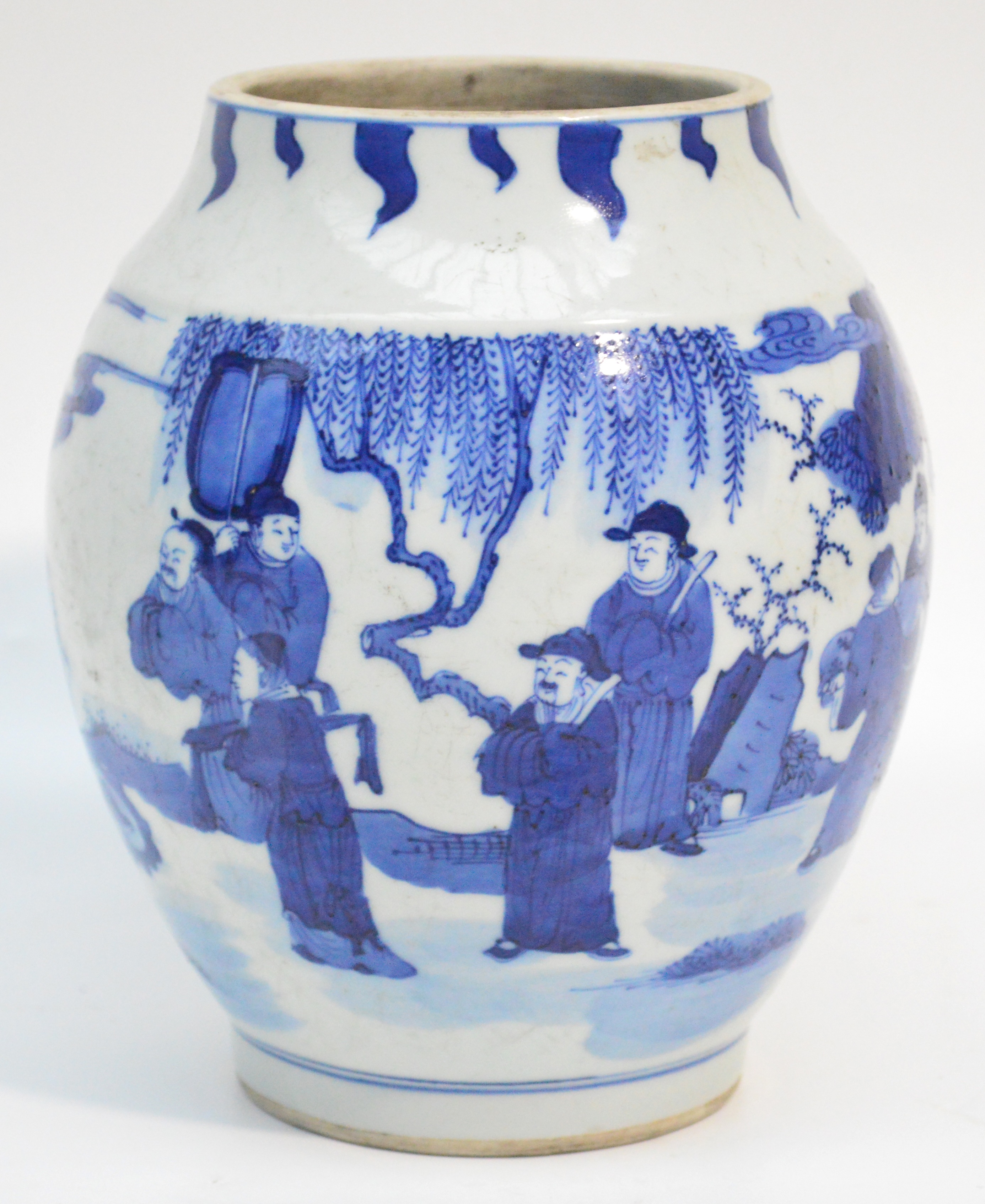 A Chinese porcelain ovoid vase, finely painted in underglaze blue with scholars beneath pine trees