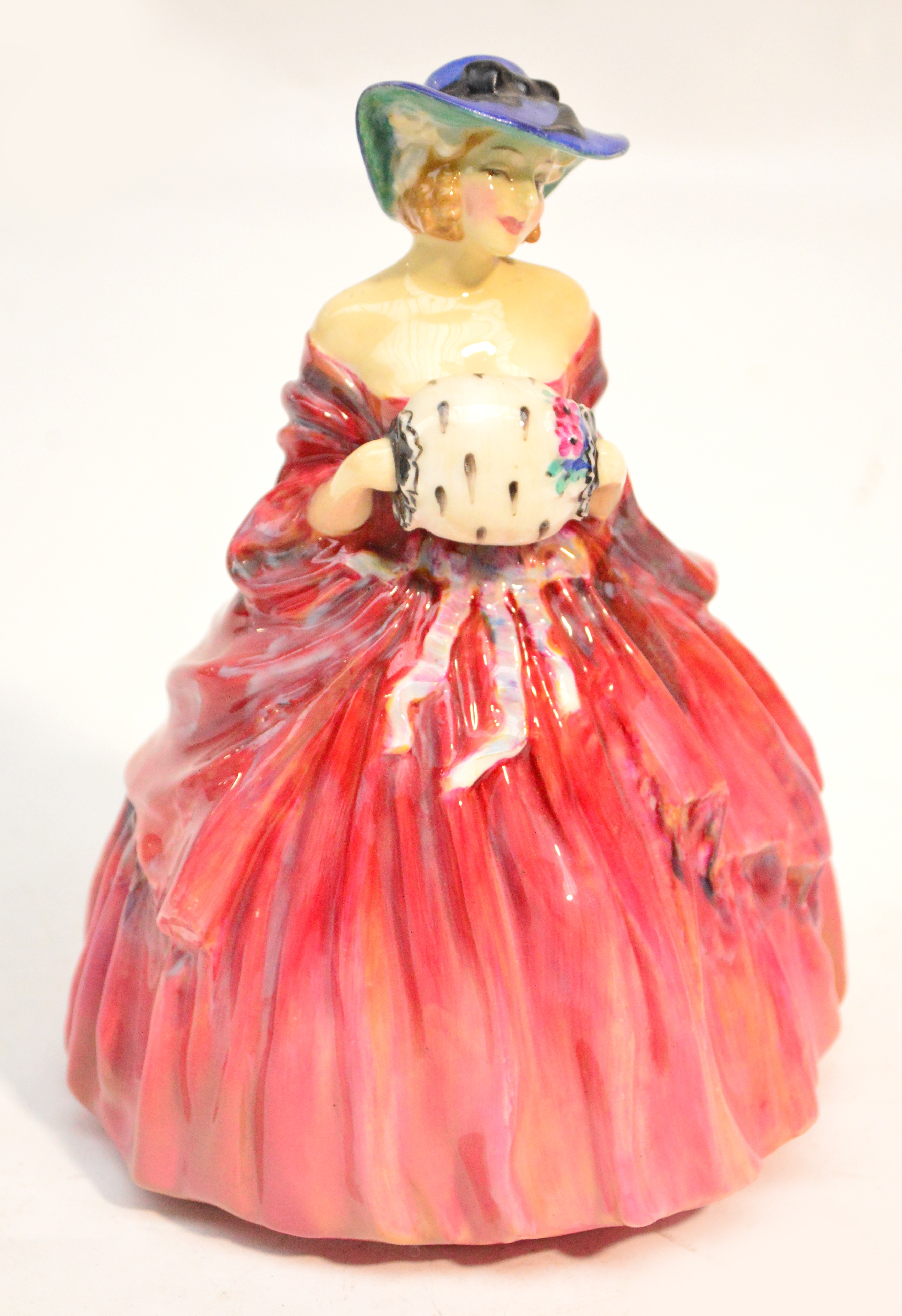 A Royal Doulton figurine HN1962 "Genevieve". CONDITION REPORT: Suspected restoration to bonnet.