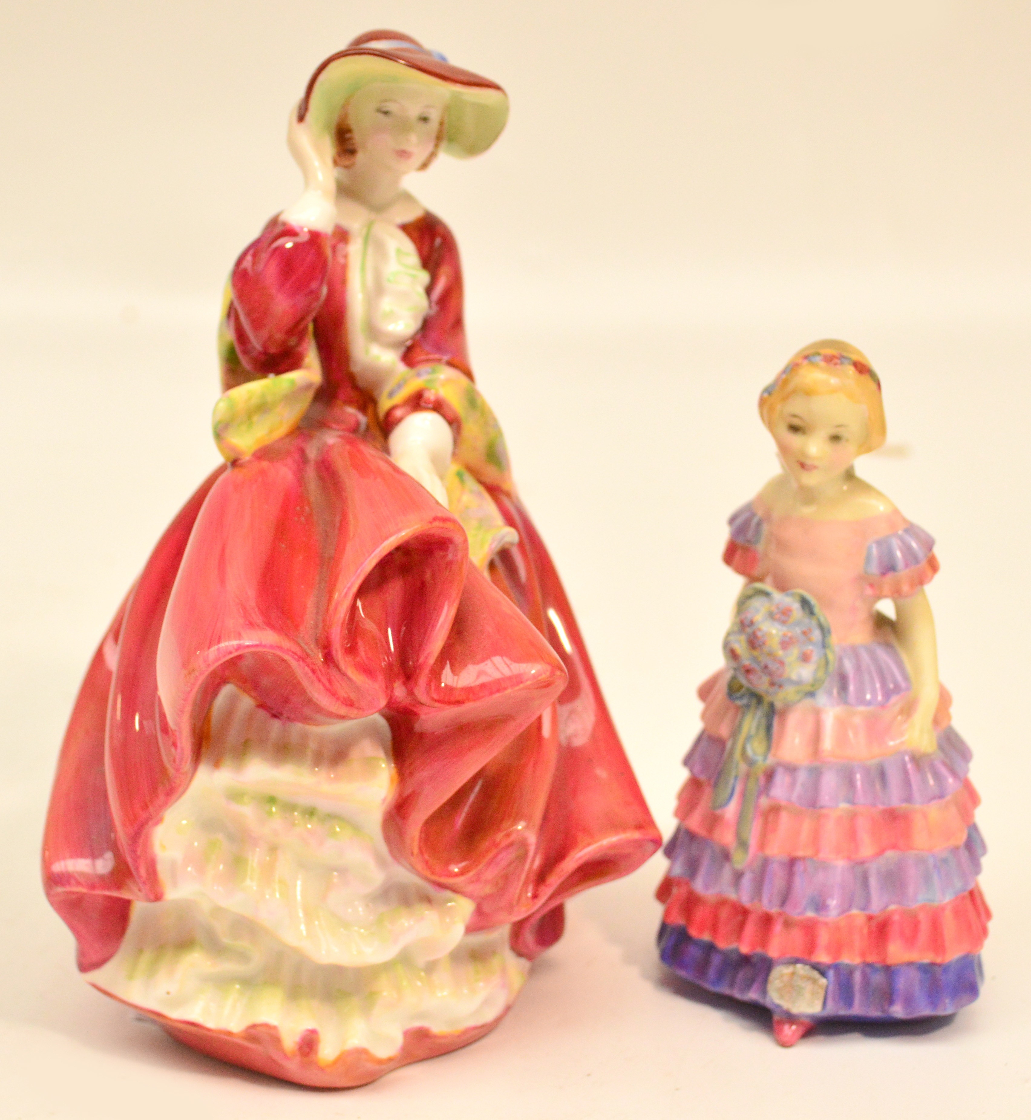 Two Royal Doulton figurines HN1433 "The Little Bridesmaid" and HN1834 "Top O' The Hill". CONDITION