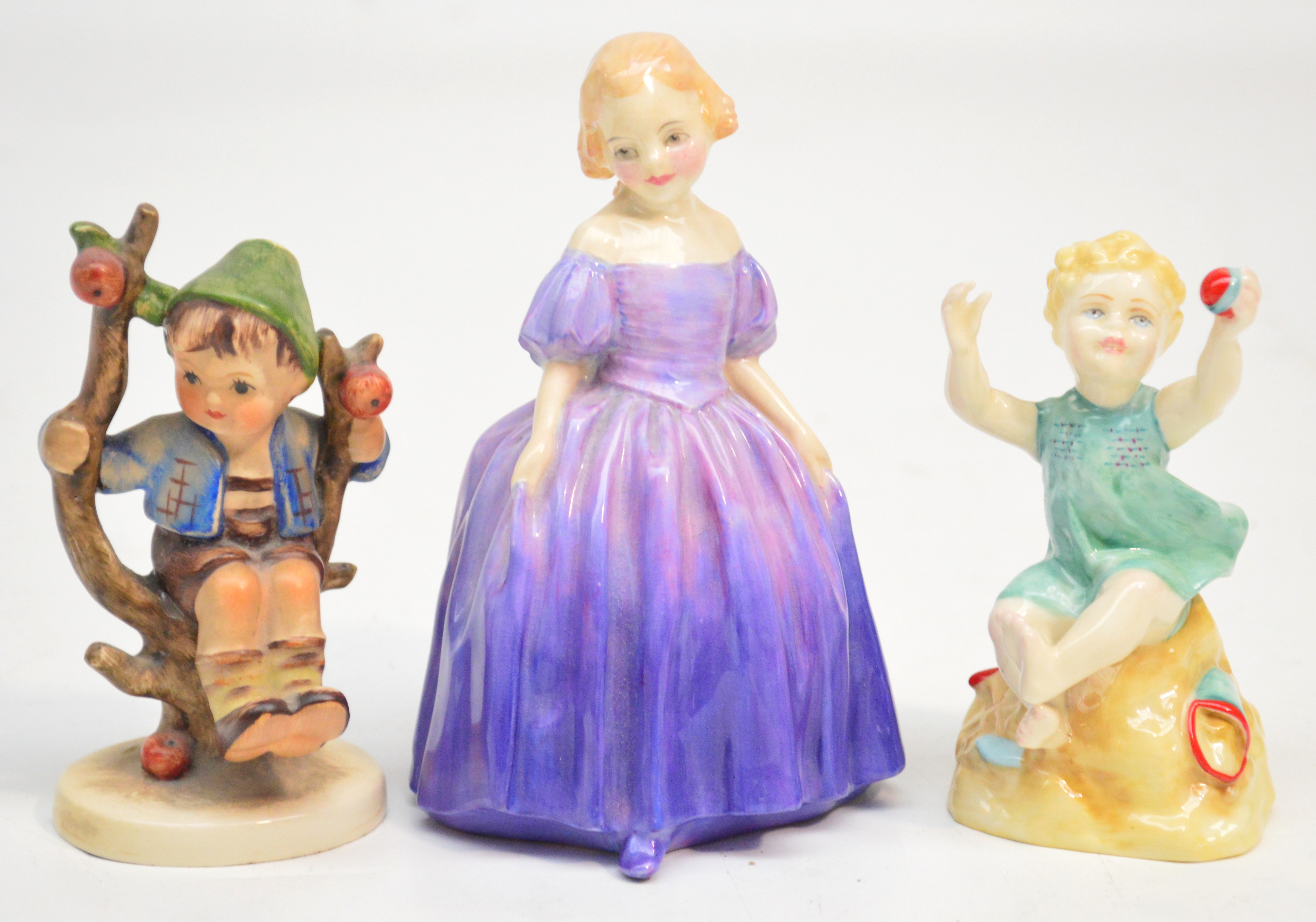 A Royal Doulton figurine HN1370 "Marie", a Royal Worcester figure "Sunshine Days" and a Hummel