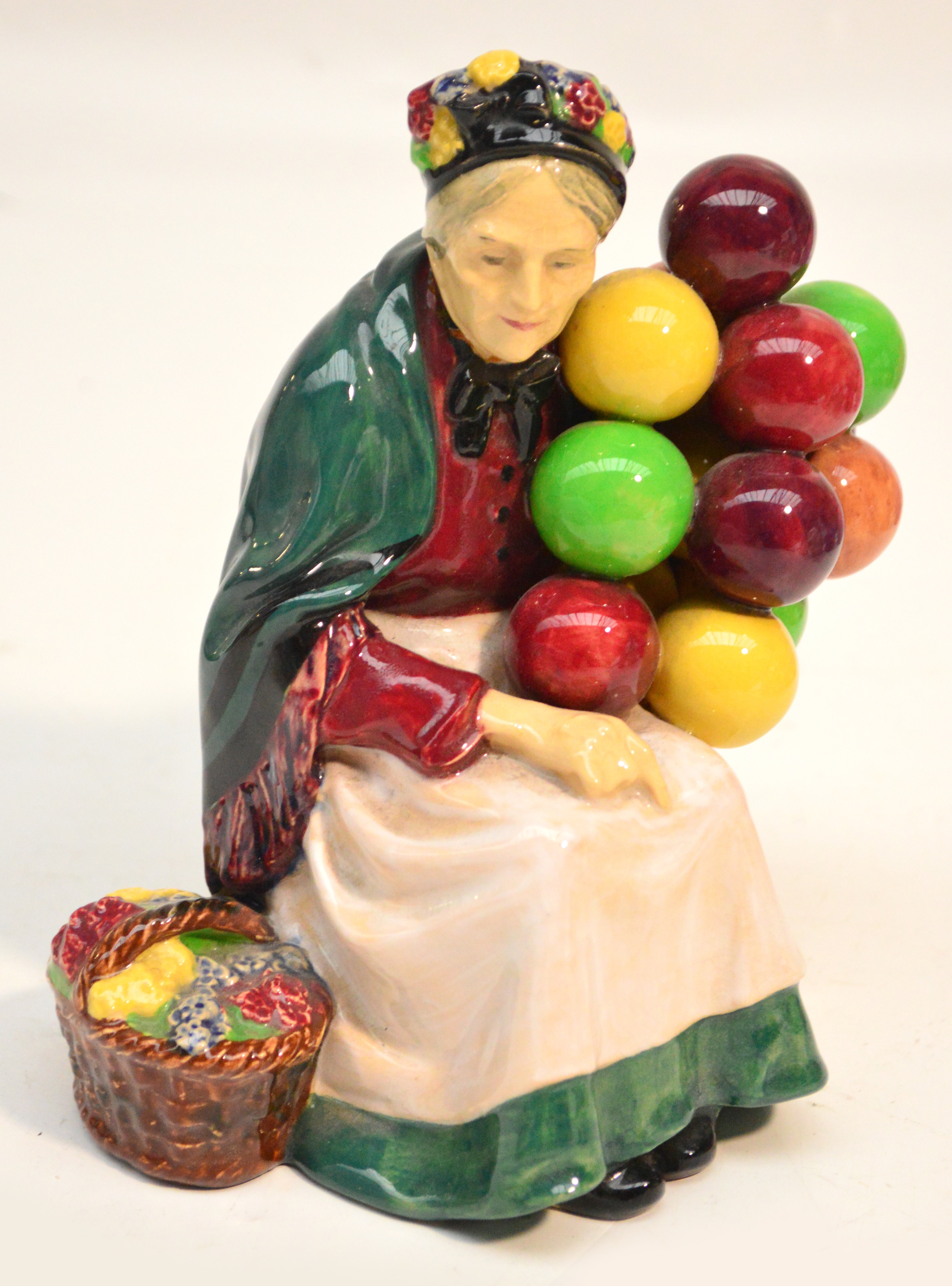 A Royal Doulton figurine HN1315 "Old Balloon Seller" (af). CONDITION REPORT: The head has been