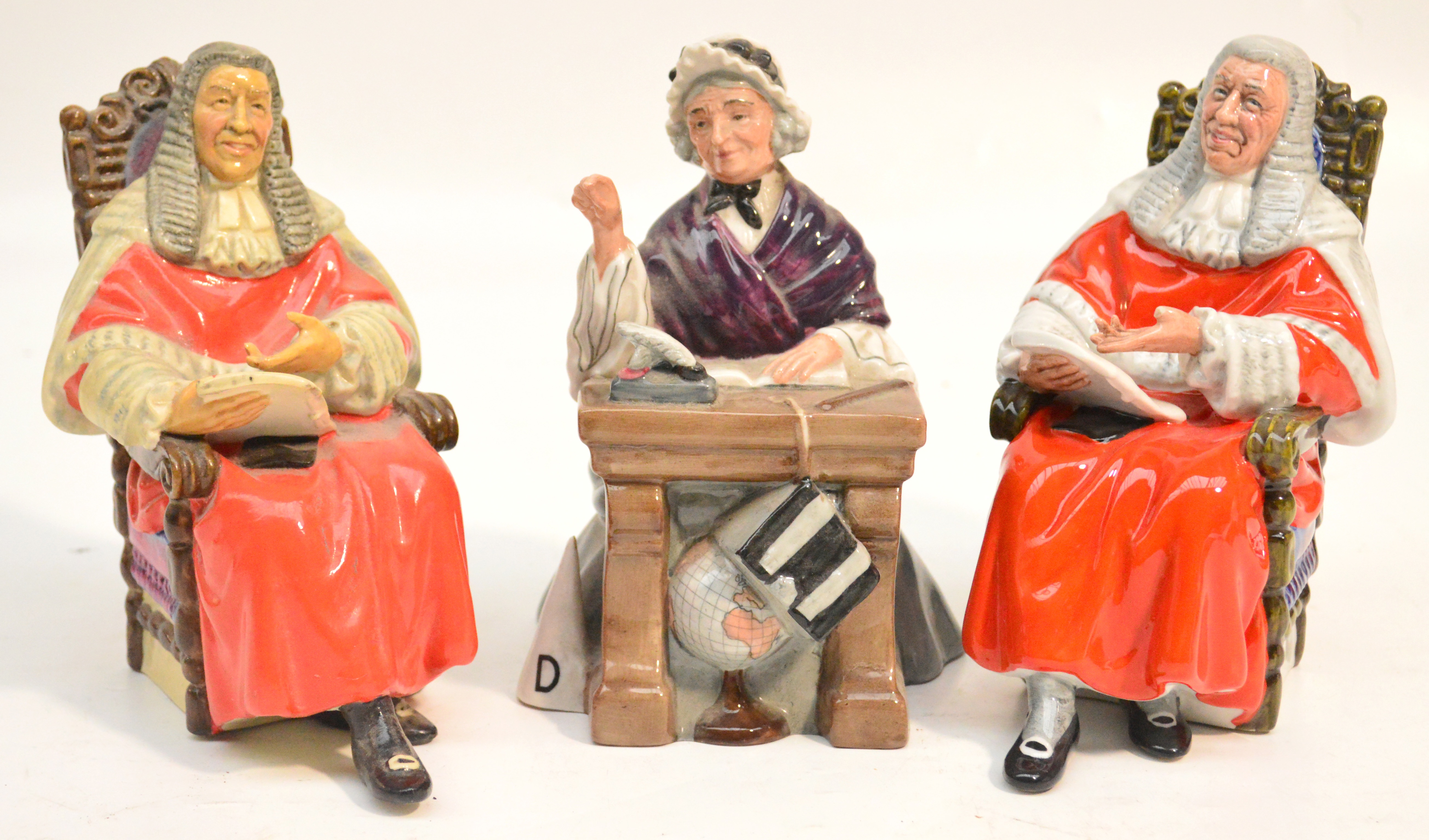 Three Royal Doulton figurines HN2223 "Schoolmarm" and 2 x HN2443 "The Judge" (one a second).