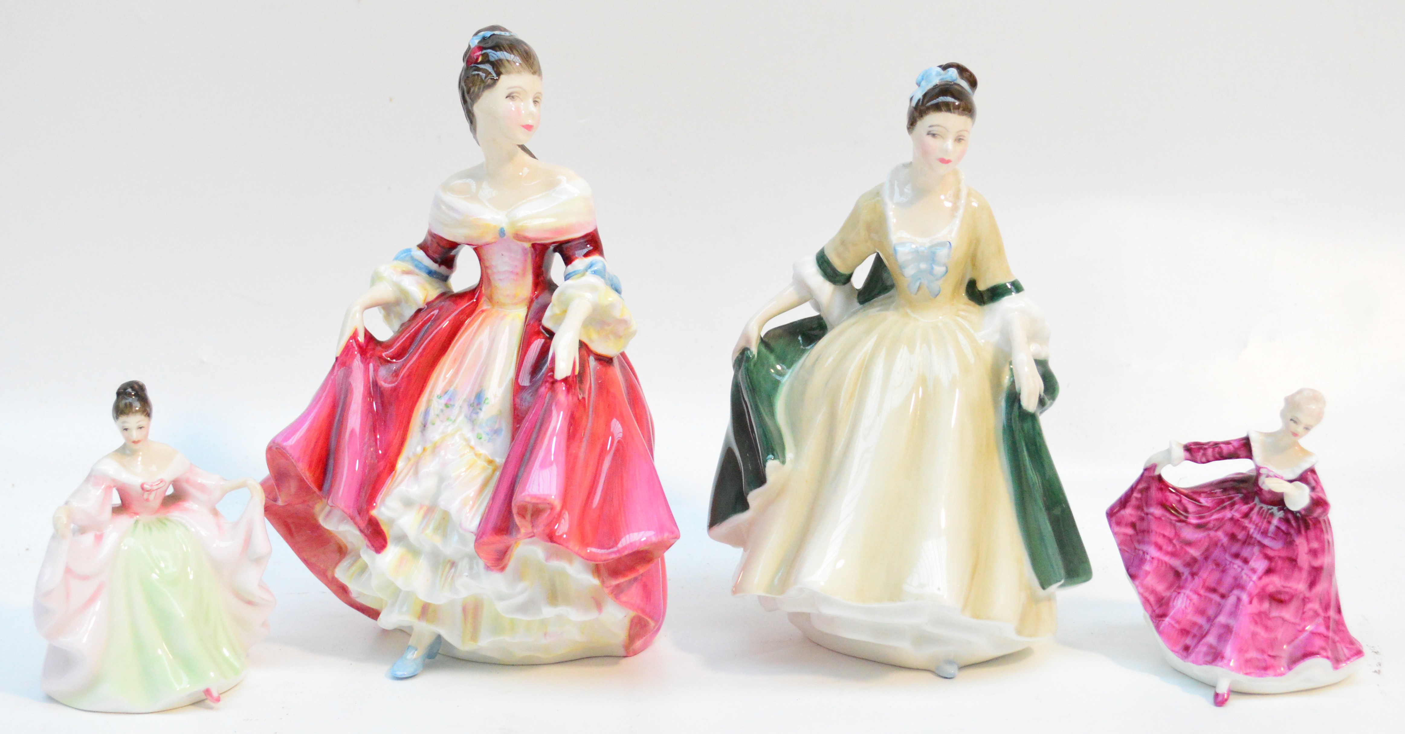 Two large Royal Doulton figurines HN2229 "Southern Belle" and HN2264 "Elegance", also smaller