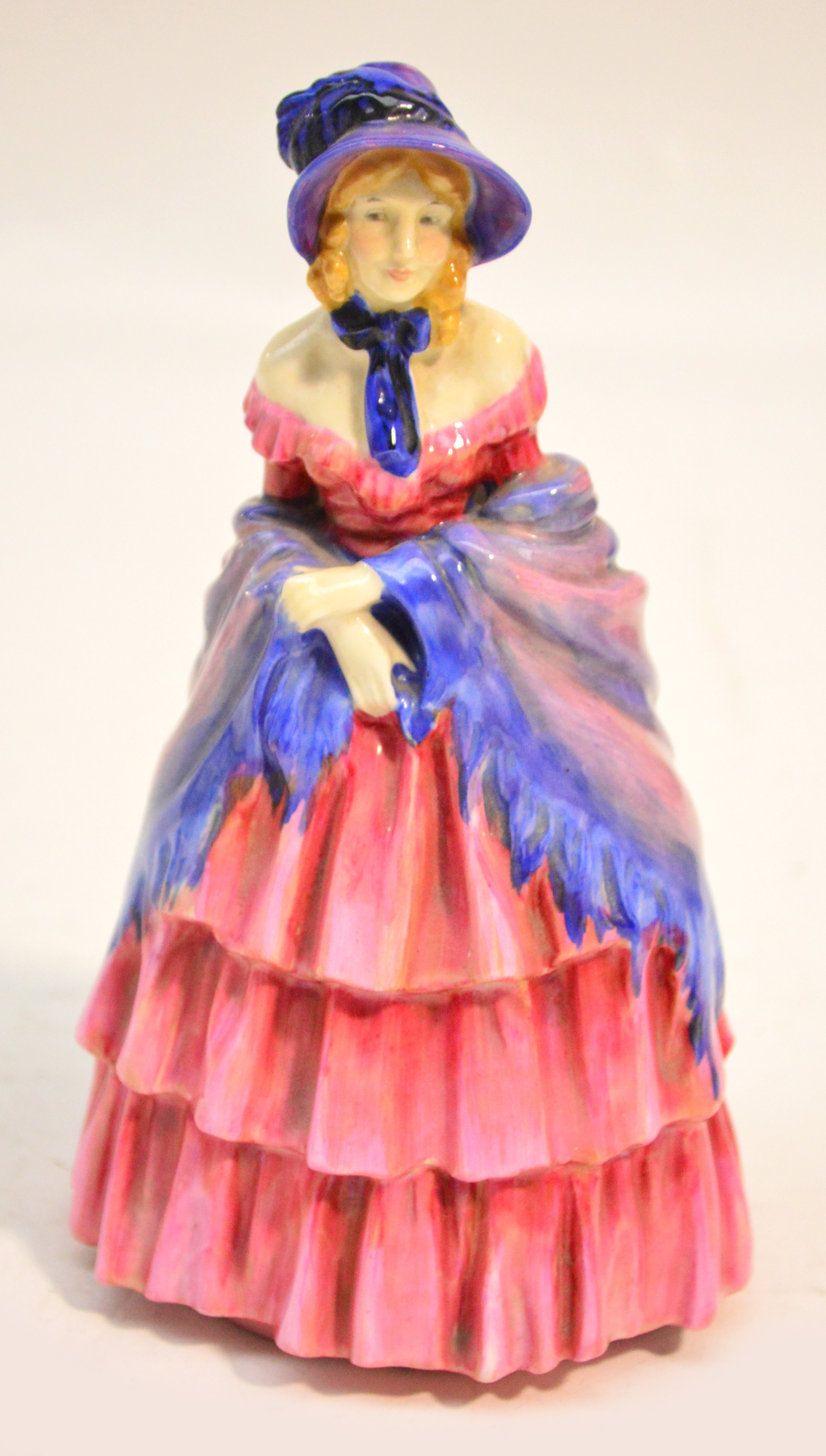 A Royal Doulton figurine HN728 "A Victorian Lady". CONDITION REPORT: Minor crazing to shawl,