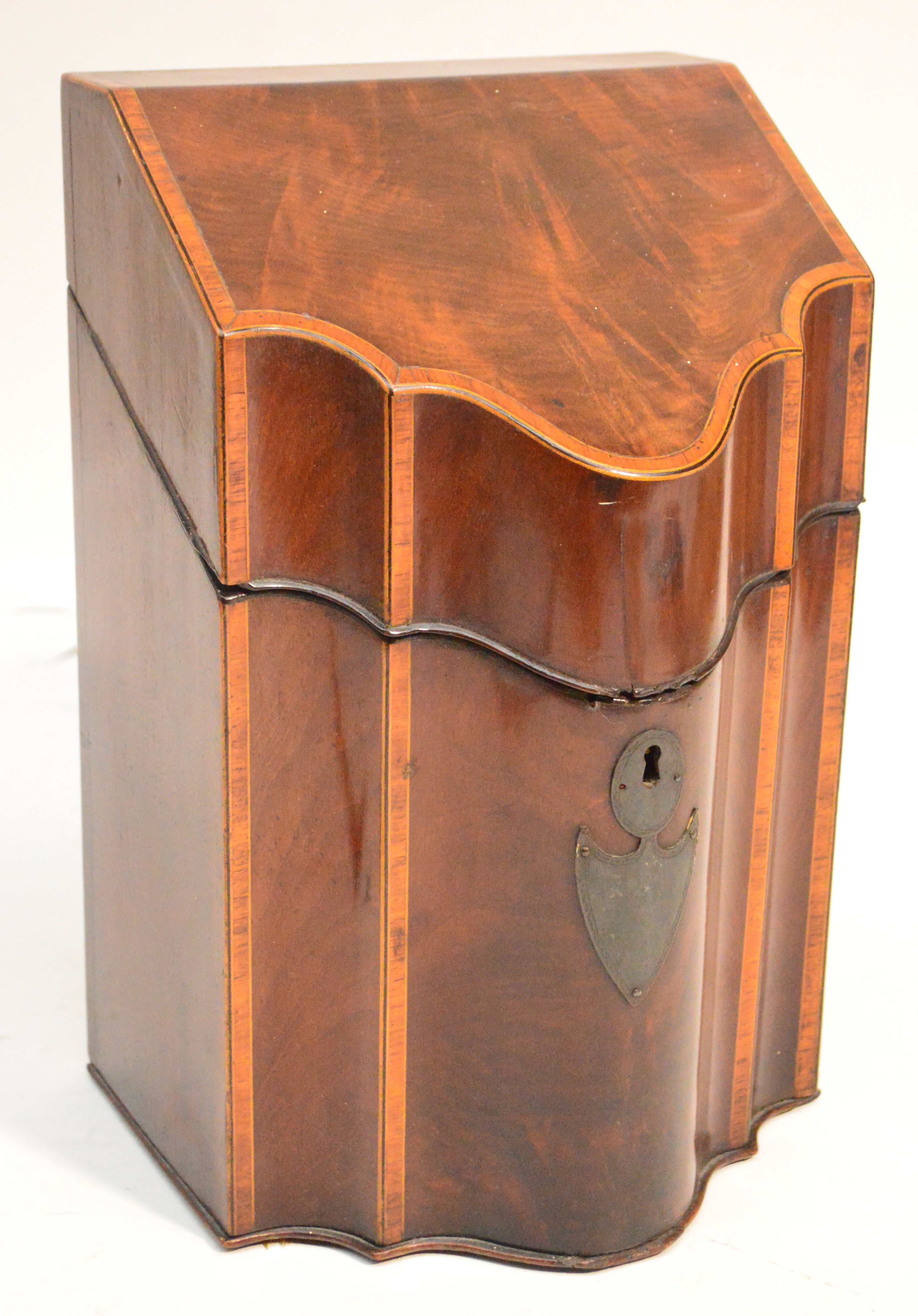 A late George III mahogany and satinwood crossbanded serpentine fronted knife box (the interior