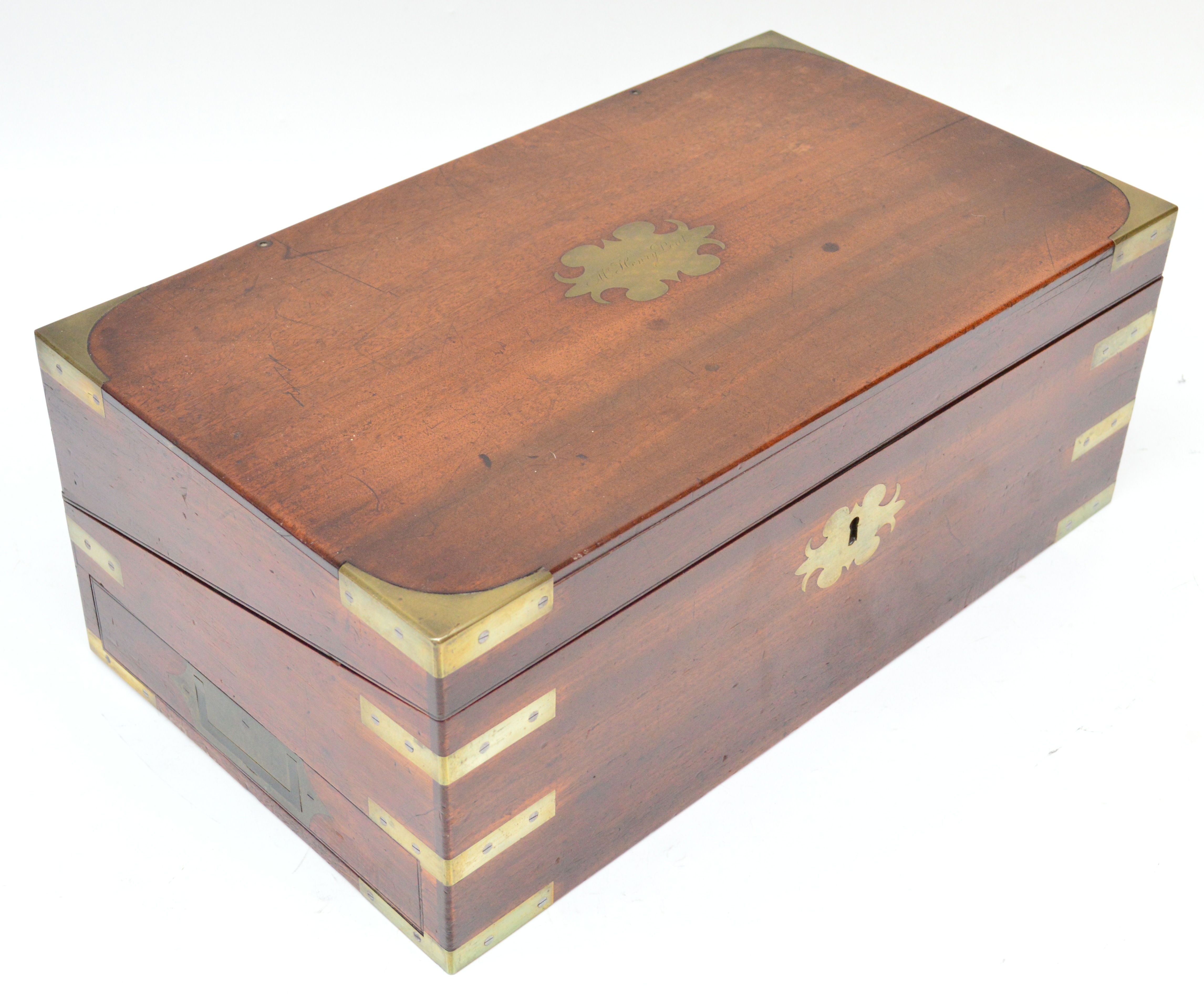 An early 19th century mahogany brass bound campaign travelling writing box, the hinged lid with