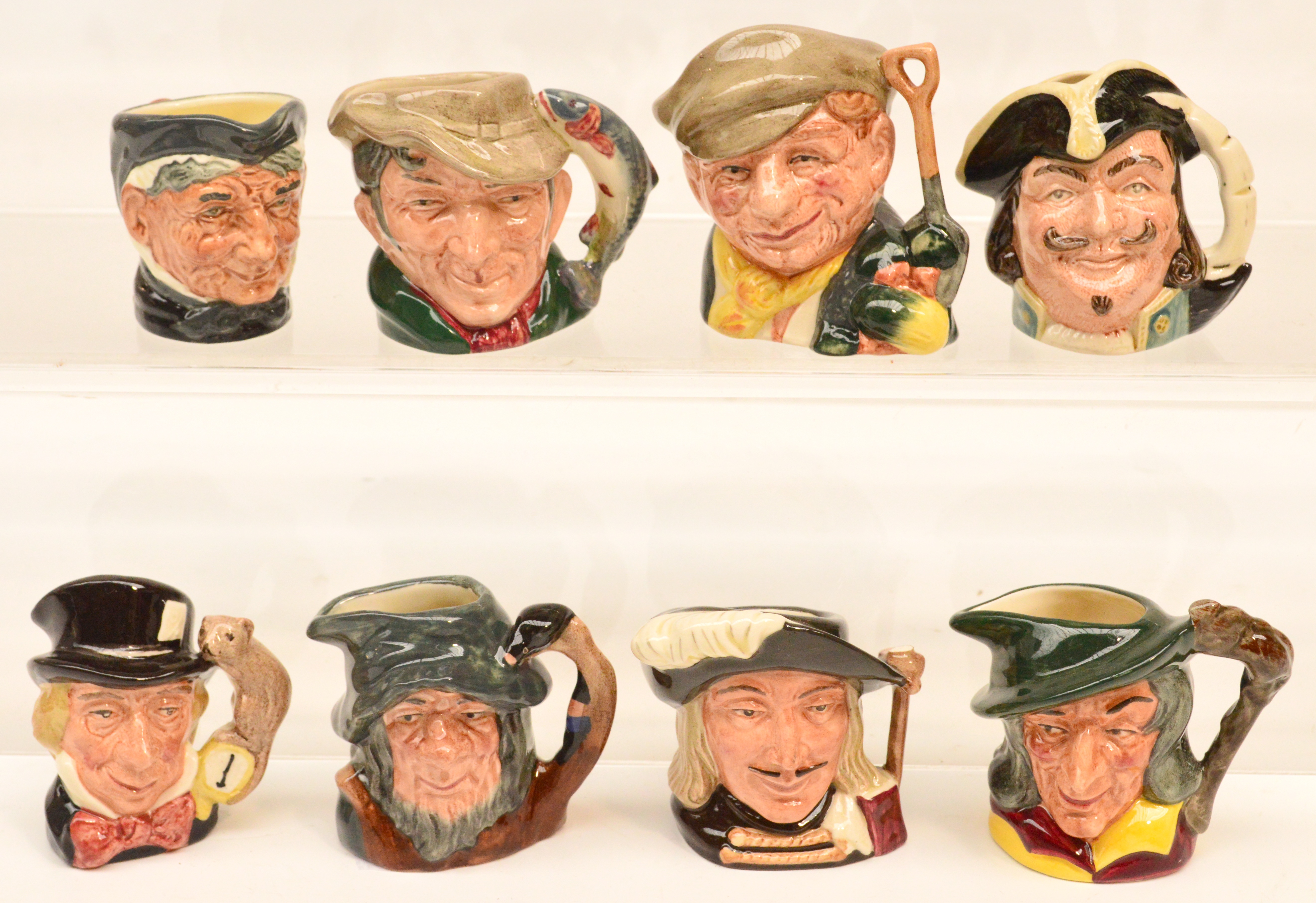 Eight Royal Doulton small character jugs including D6606 "Mad Hatter", D6515 "The Poacher", D6510 "