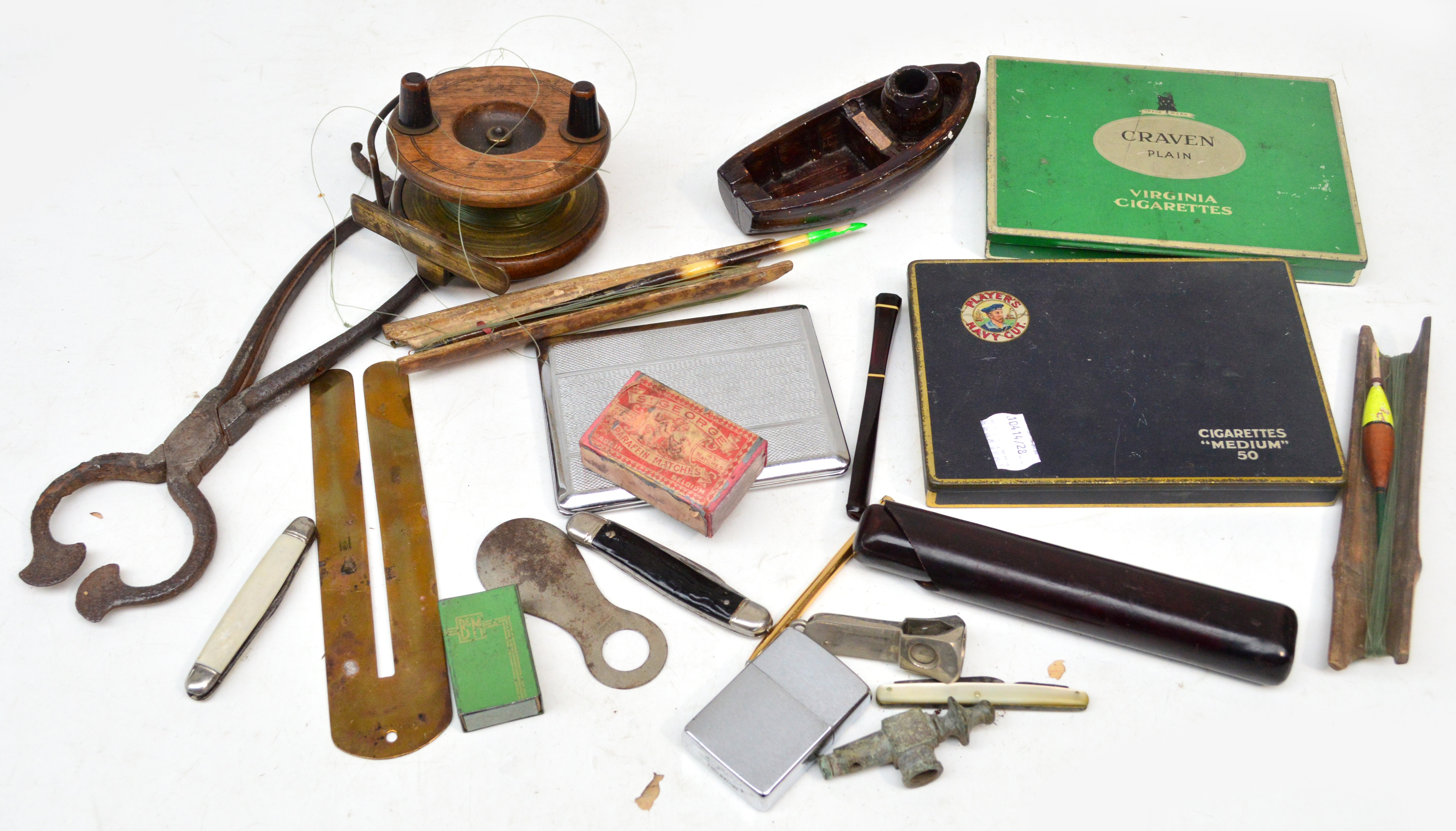 A mixed lot including a Nottingham star back fishing reel, a pair of sugar cane cutters, two tobacco