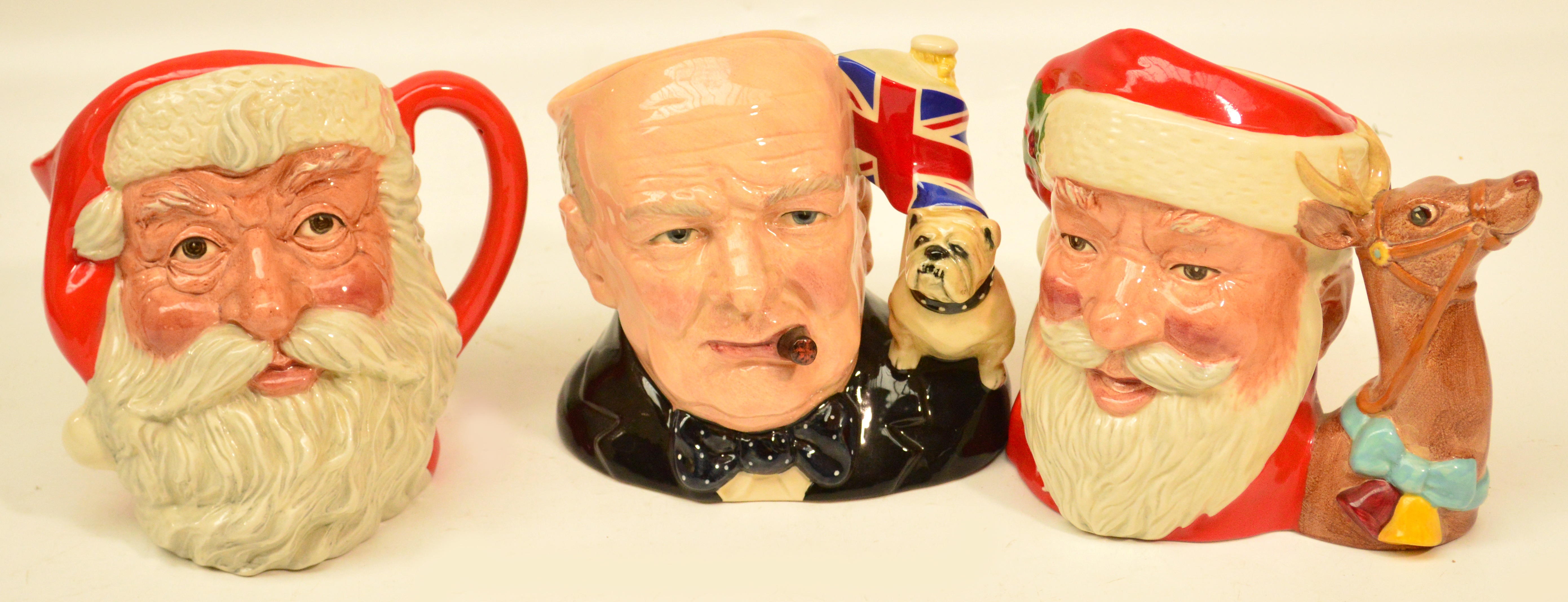 Three Royal Doulton character jugs D6675 "Santa Claus", D6704 "Santa Claus" (second), D6907 "Winston