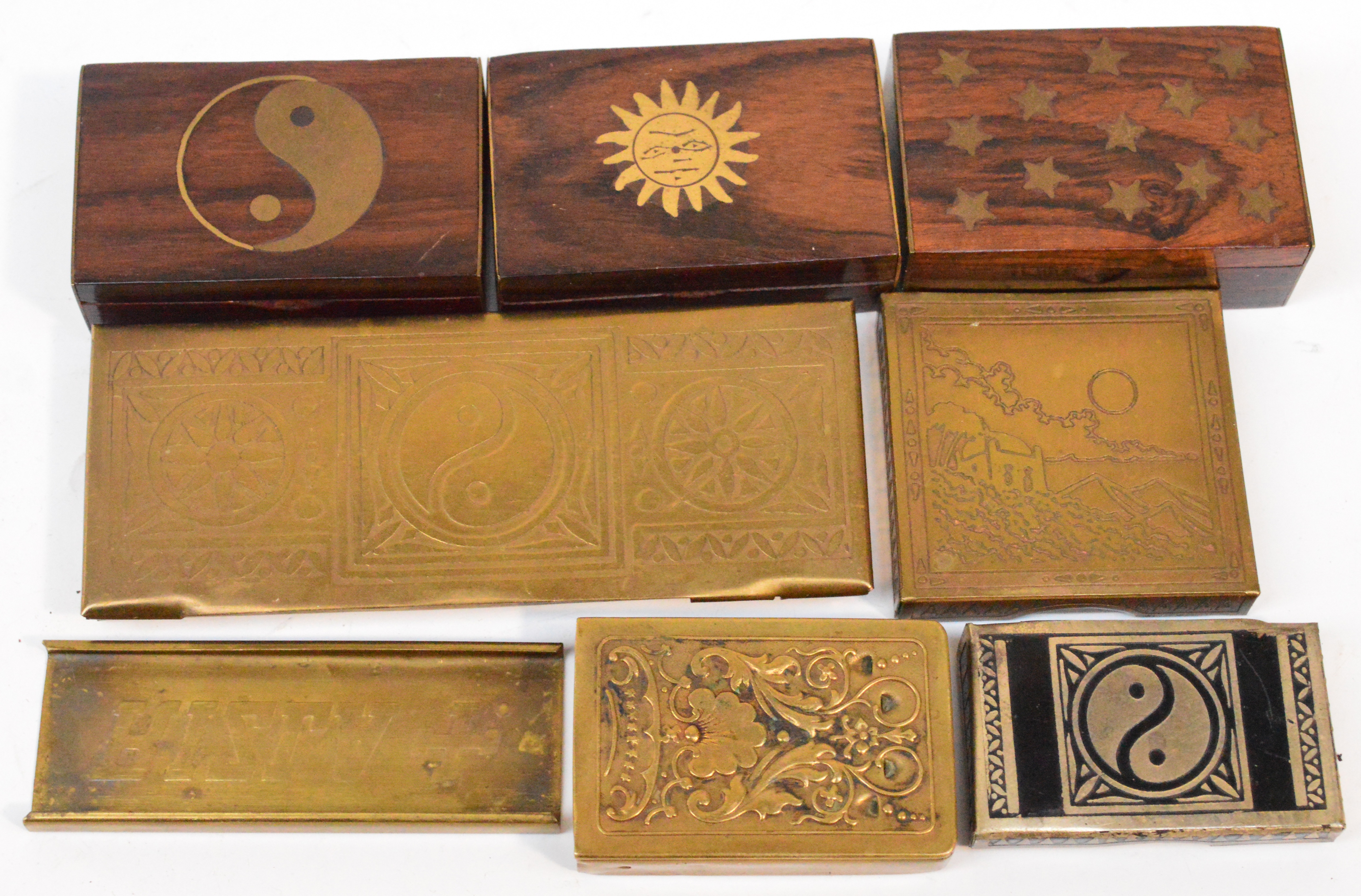 Seven assorted boxes including three rosewood and brass inlaid snuff boxes, a brass vesta embossed