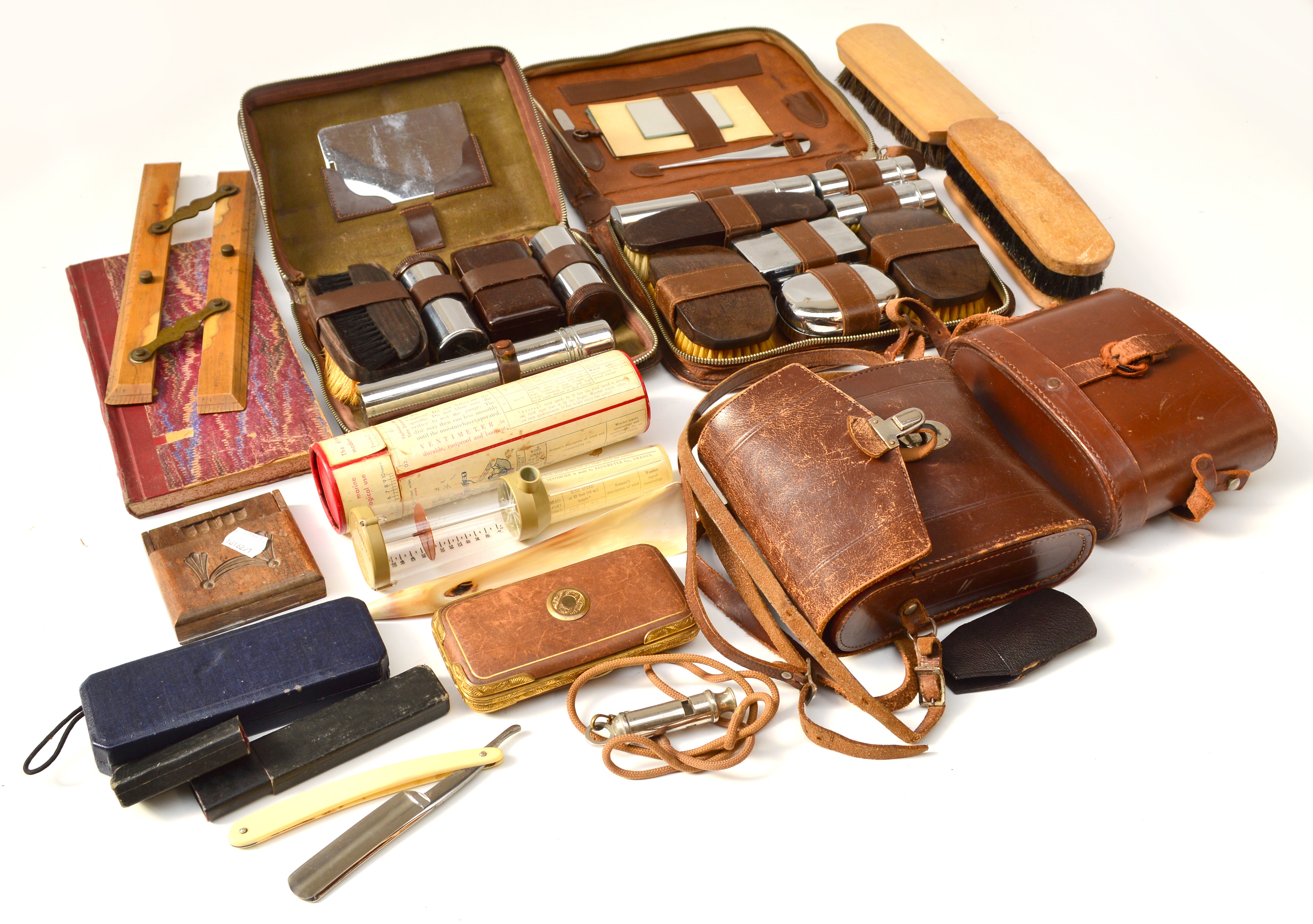 A quantity of collectables including two pairs of binoculars, two travelling toilet sets, brushes,