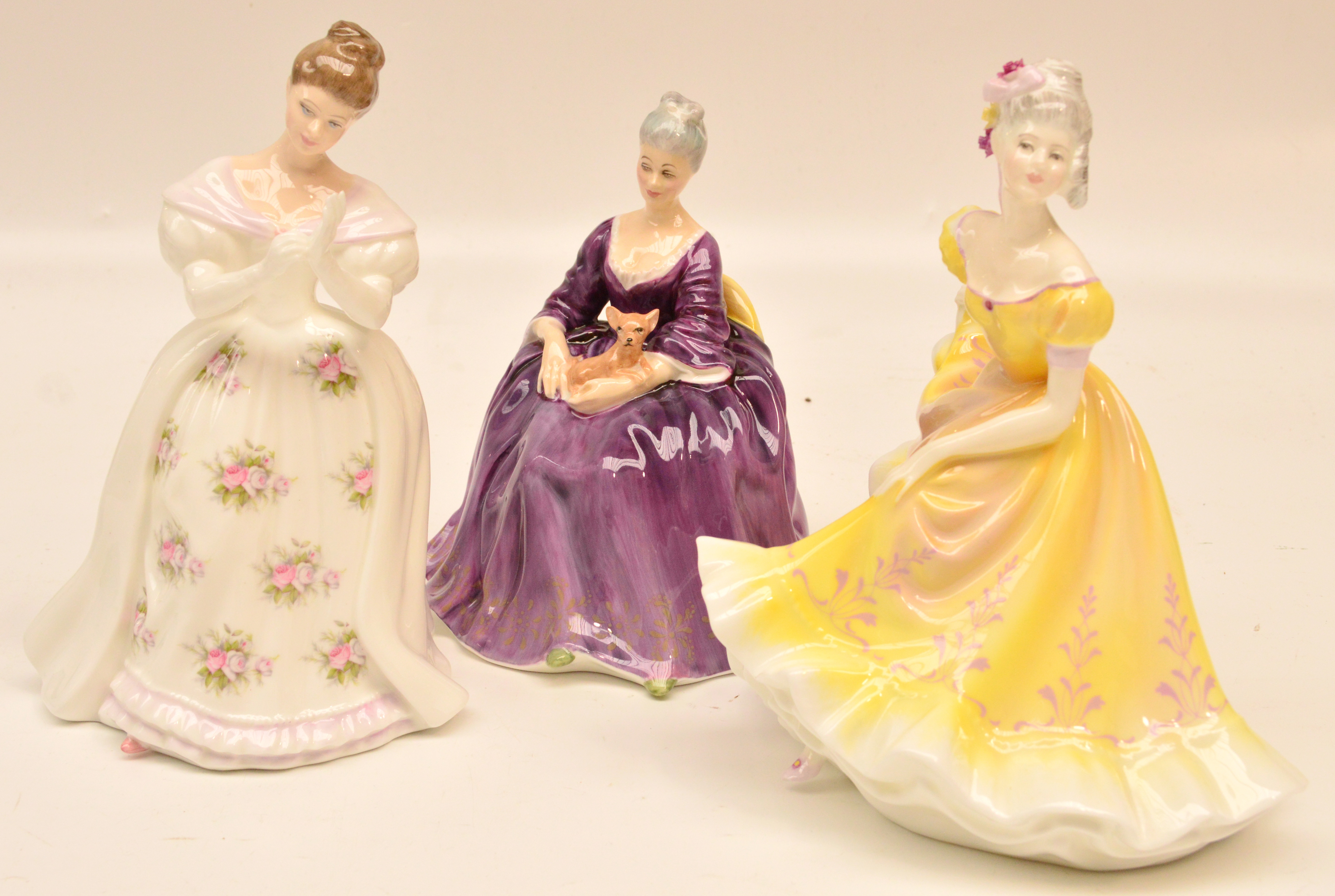 Three Royal Doulton figurines HN3309 "Summer Rose", HN2421 "Charlotte" and HN2379 "Ninette".