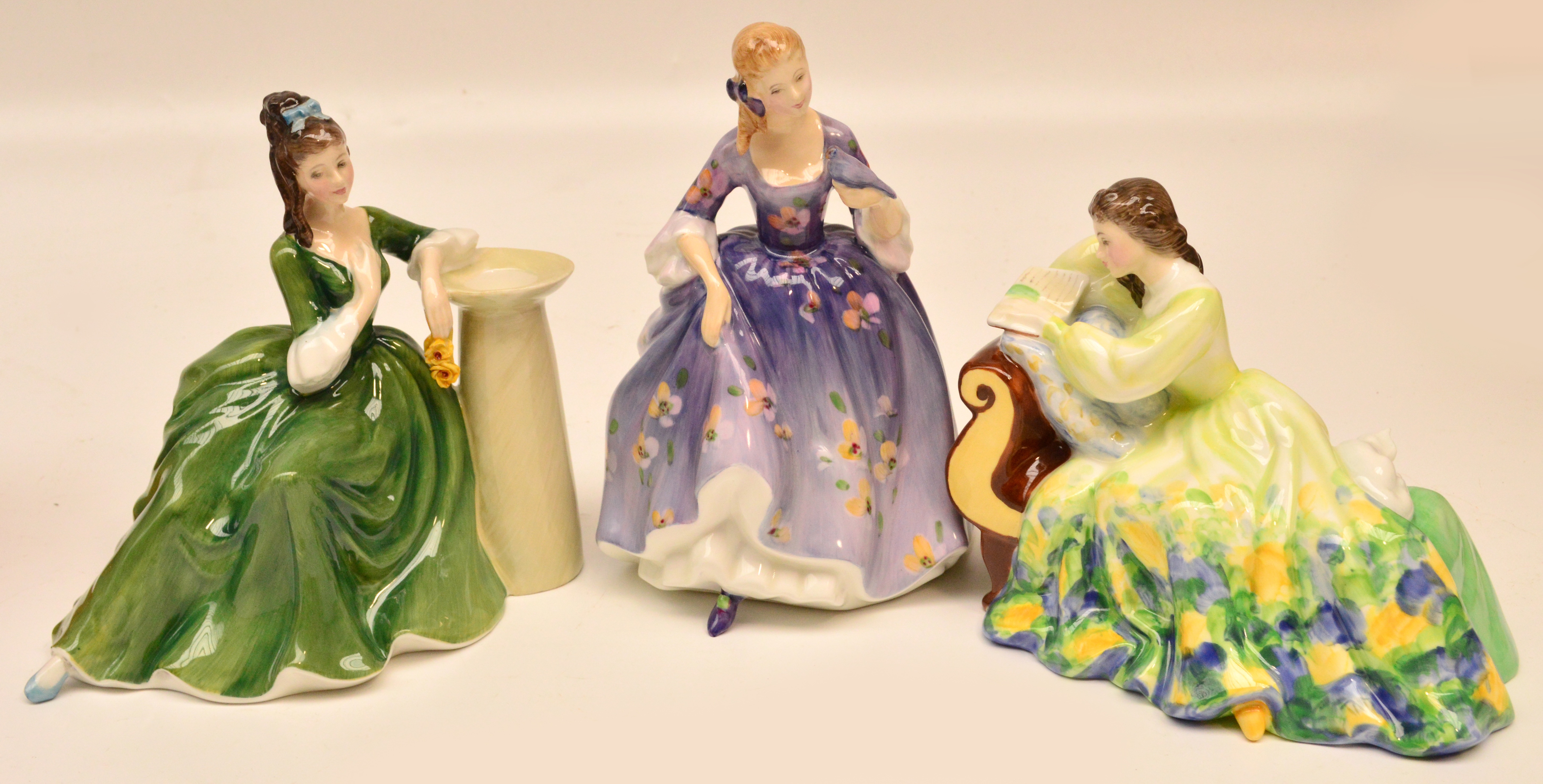 Three Royal Doulton figurines HN2382 "Secret Thoughts", HN2839 "Nicola" and "HN2810 "Solitude".