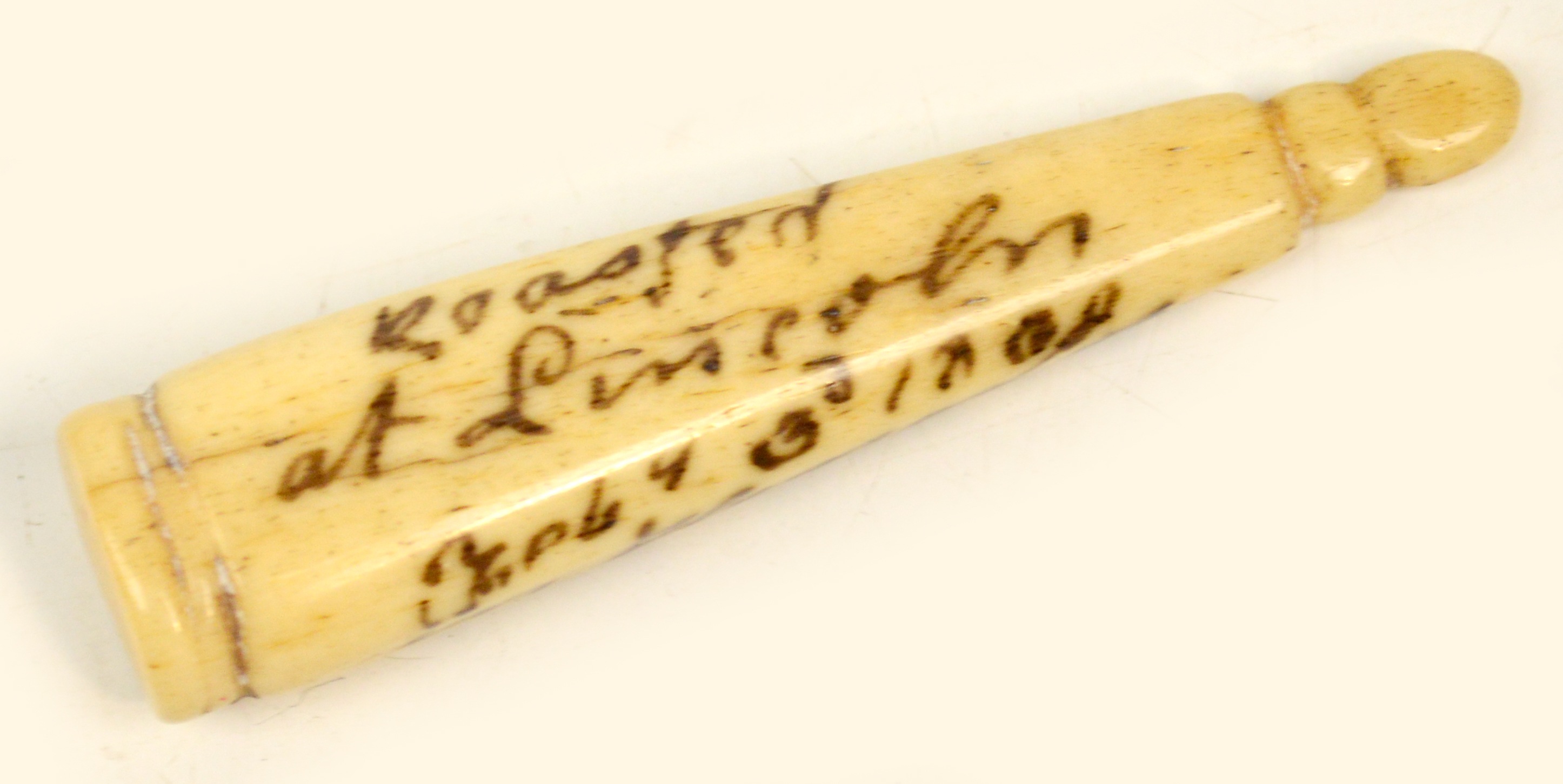 An unusual George III bone pipe tamper inscribed "Roasted at Lincoln February 3rd 1808 in Honour