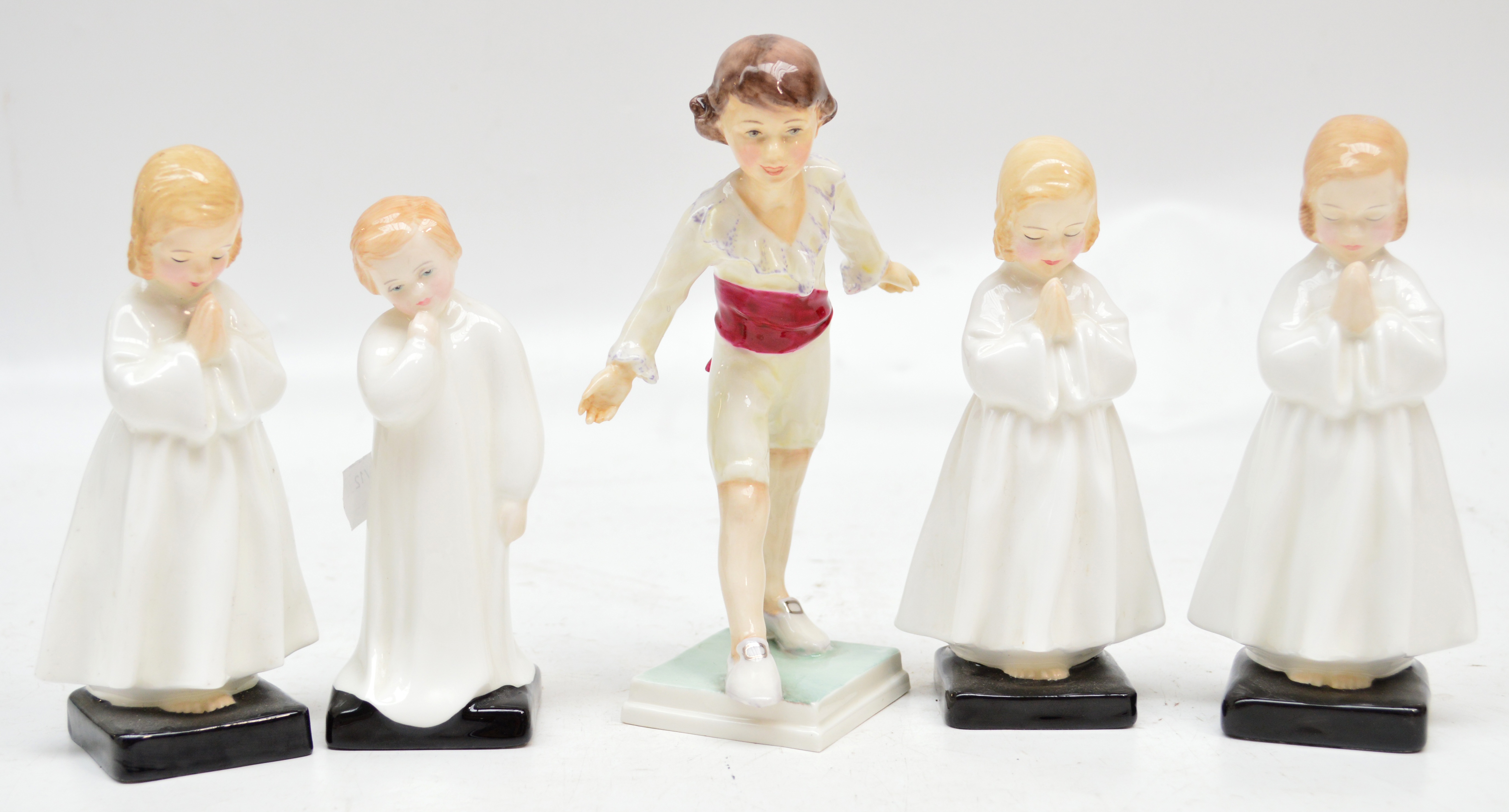 A set of four Royal Doulton figurines comprising three HN1978 "Bedtime", HN1985 "Darling" also a