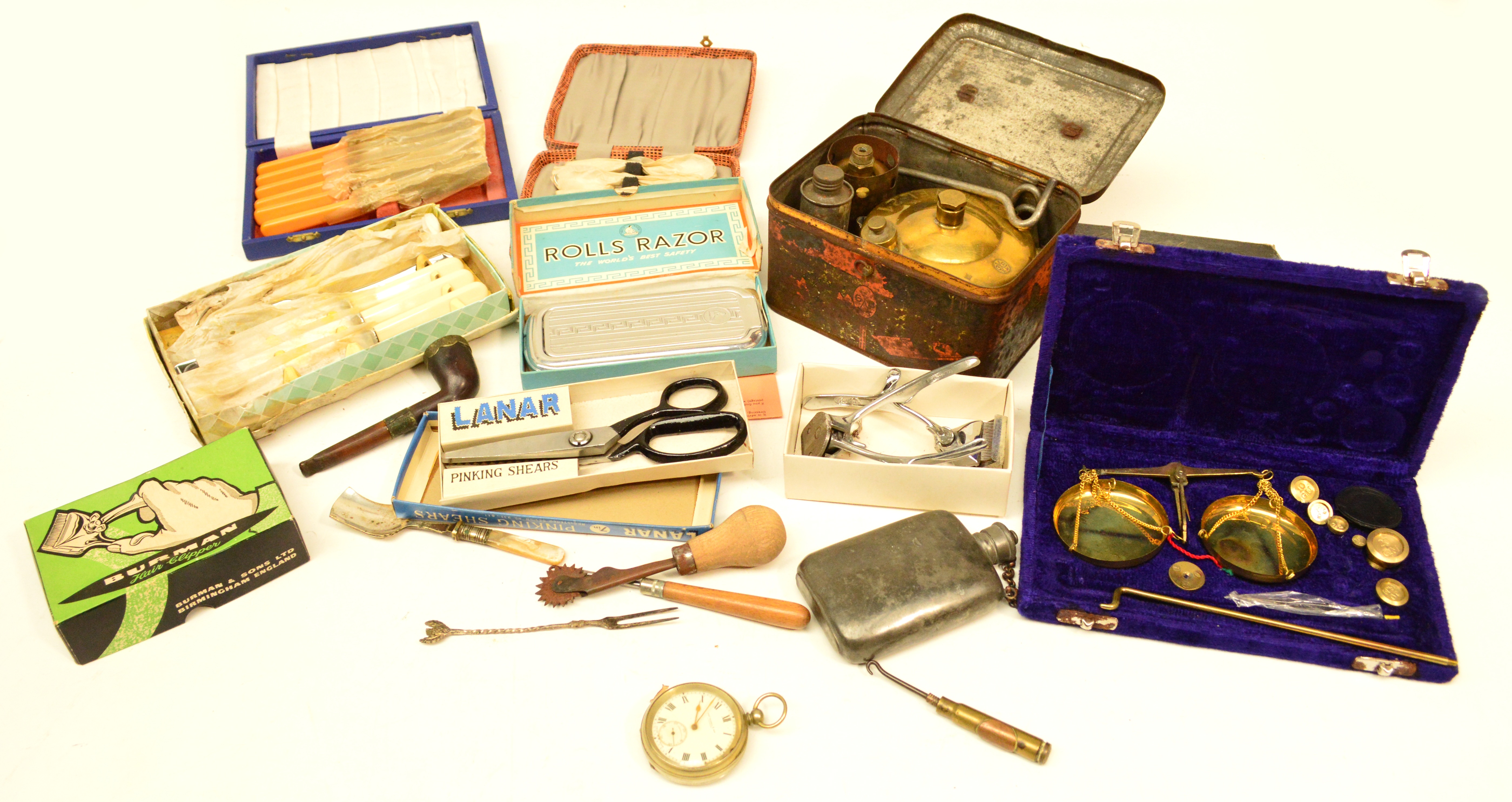 A mixed lot including a pocket watch, pipe with Stanhope view of Blackpool, brass stove, boxed