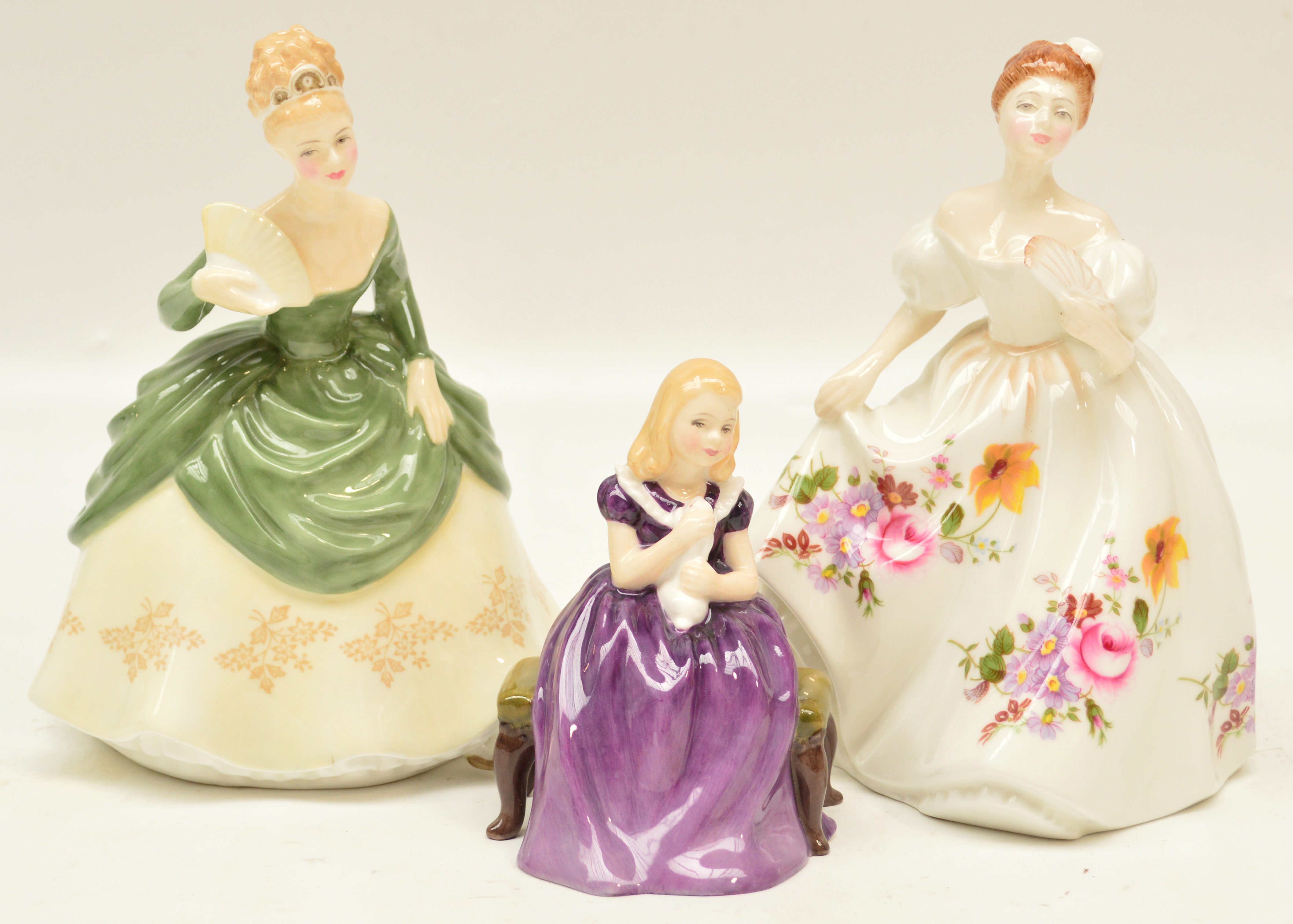 Three Royal Doulton figurines HN2236 "Affection", HN3002 "Marilyn" and HN2312 "Soirée". CONDITION