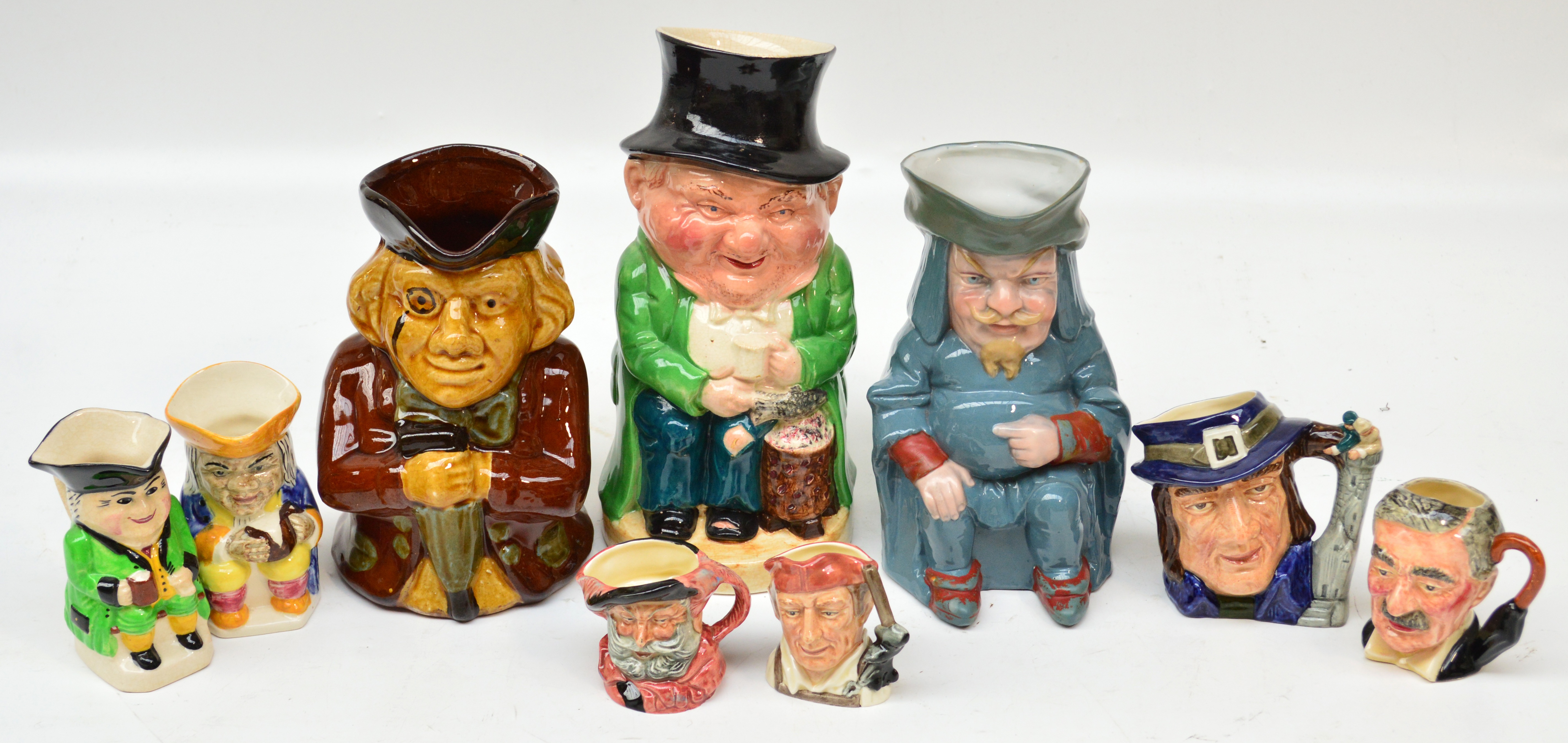 A Royal Doulton character jug D6563 "Gulliver" and two smaller D6519 "Falstaff" and D6585 "