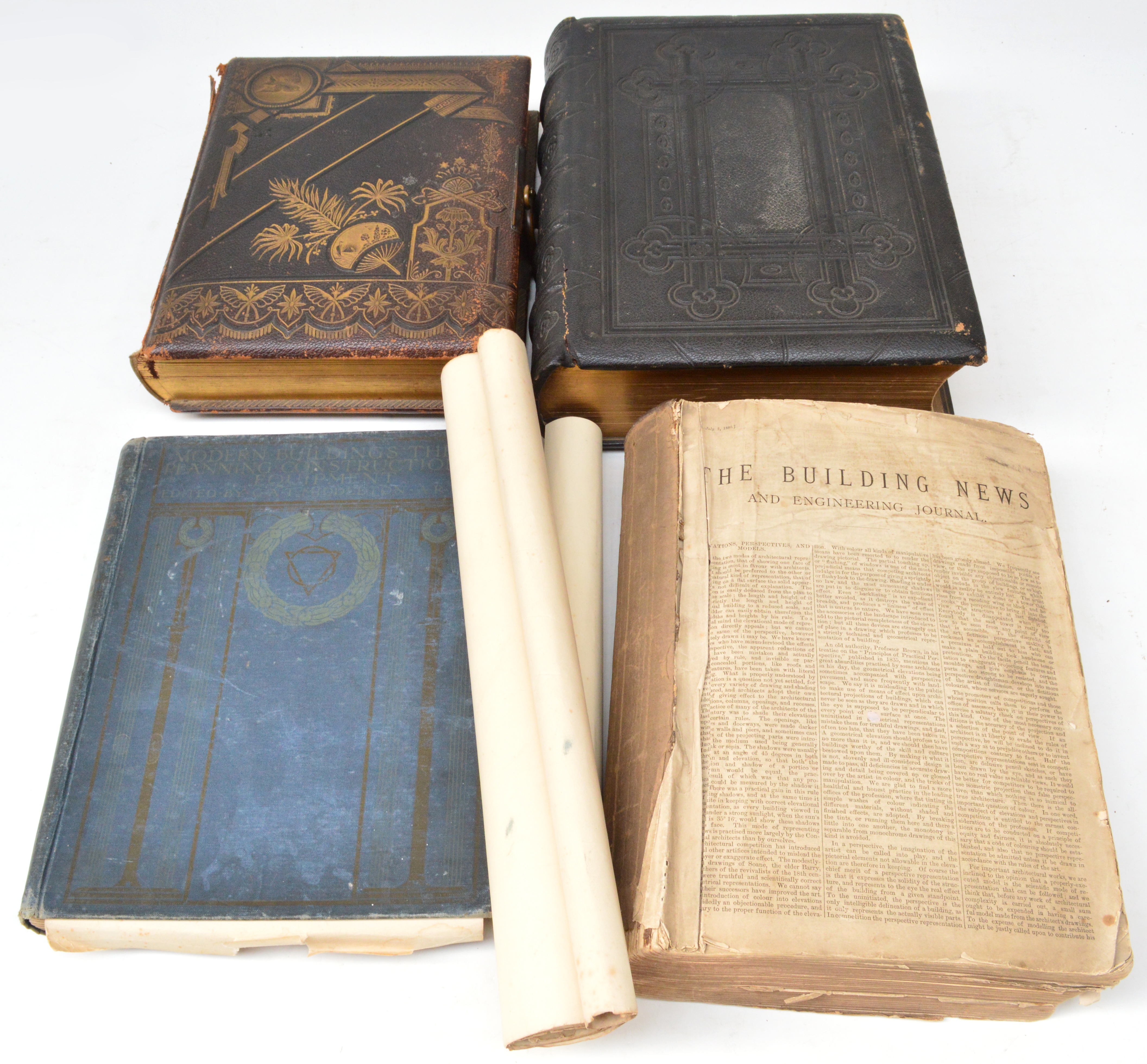 A 19th century photograph album with musical movement, a 19th century family bible, Modern