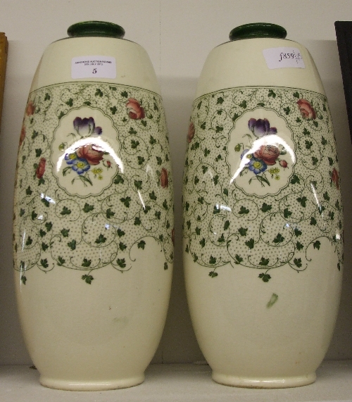 A Pair of Mintons `Barton` Pattern Vases, decorated with floral patterns on an overall white and