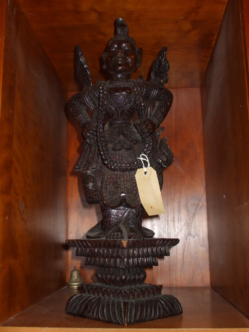 A South East Asian Carved Wooden Figure of a Dancer.