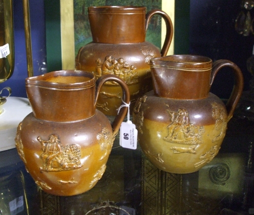 A Doulton Lambeth Stoneware Harvest Jug & two similar unmarked.