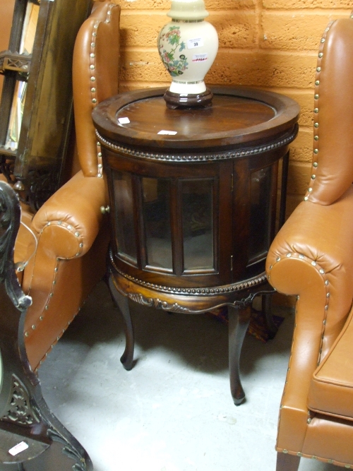 A 20th Century Mahogany Drum Table.