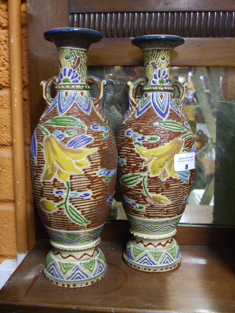 A Pair of Vases, hand painted with raised geometric designs and central flower.